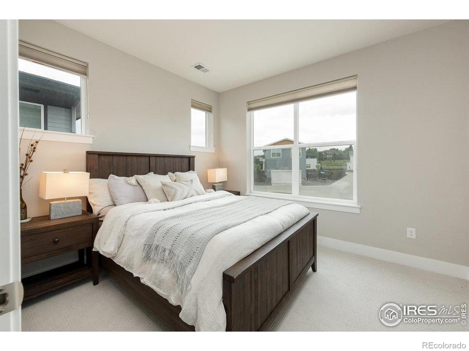 730 Promenade Drive Superior, CO 80027 - Photo 35 of 50 a bedroom with a bed and a window