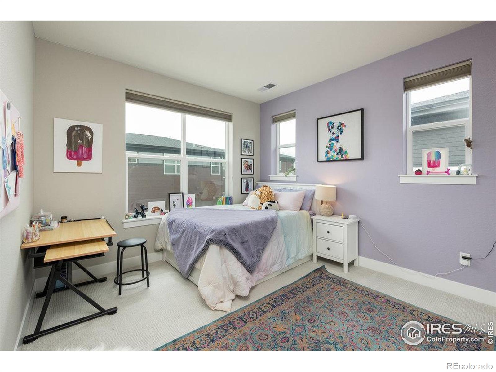 730 Promenade Drive Superior, CO 80027 - Photo 37 of 50 a spacious bedroom with a bed and a window