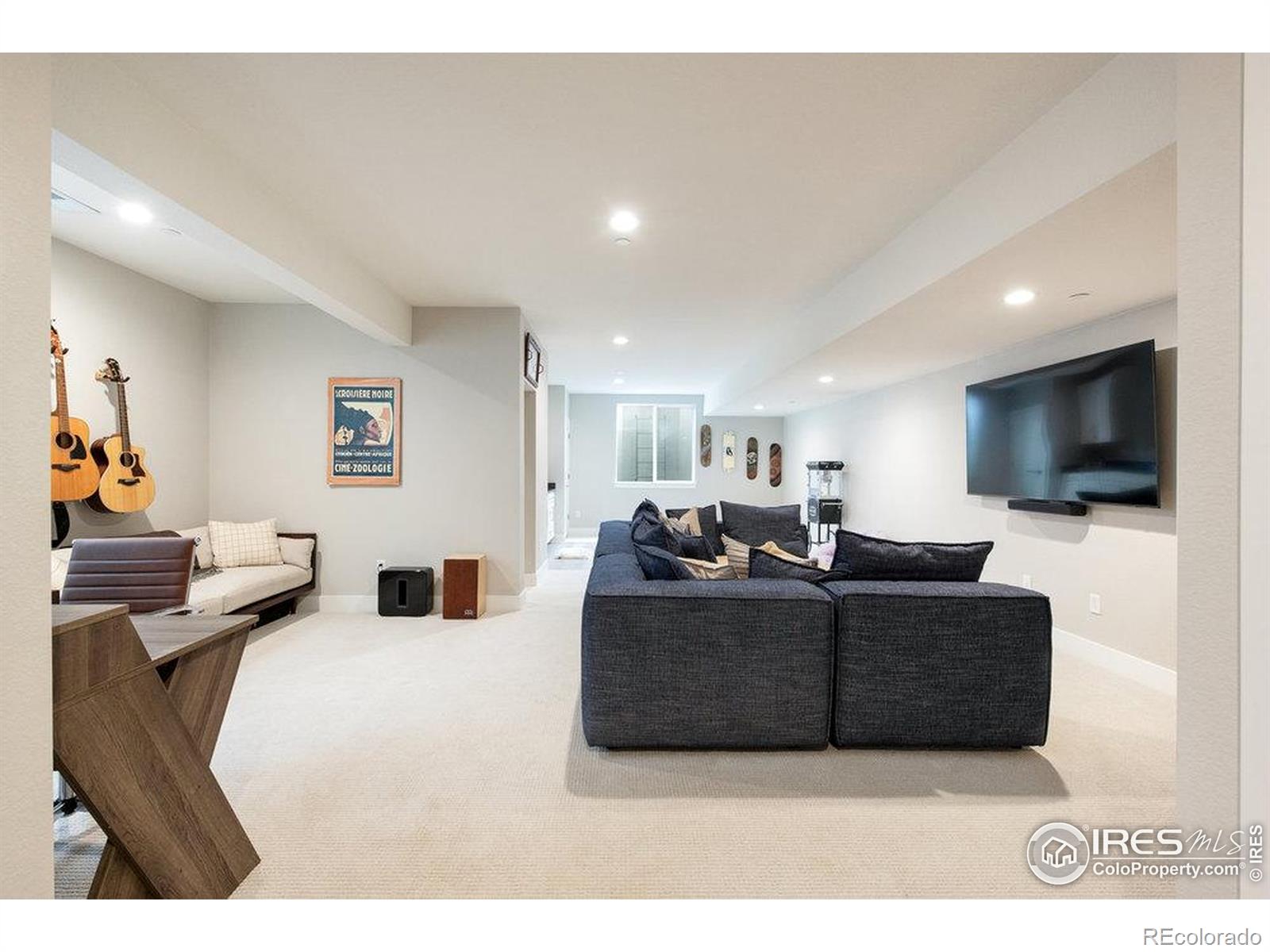 730 Promenade Drive Superior, CO 80027 - Photo 39 of 50 a living room with furniture and a flat screen tv