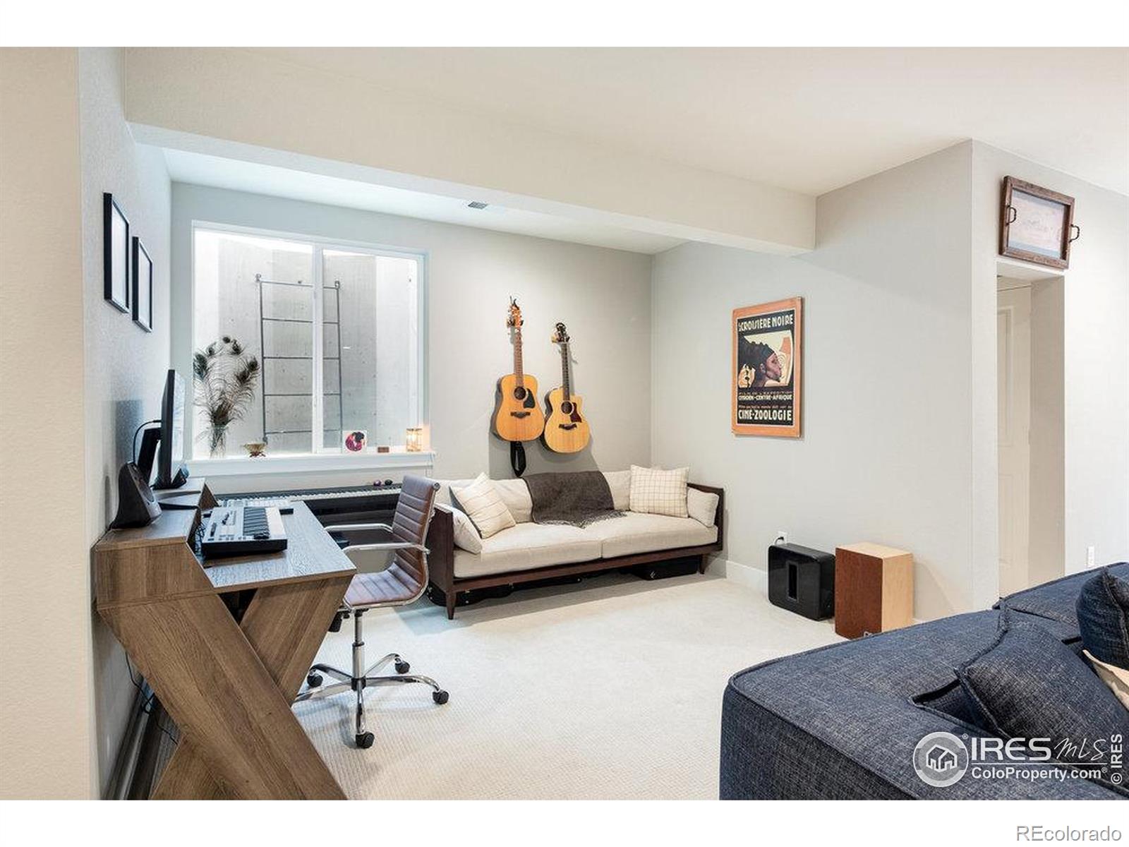 730 Promenade Drive Superior, CO 80027 - Photo 40 of 50 a living room with furniture and a large window