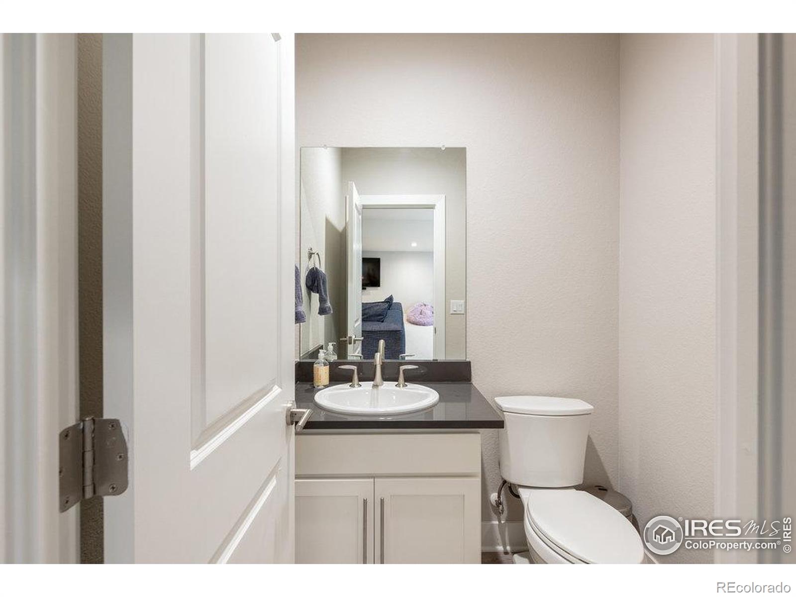 730 Promenade Drive Superior, CO 80027 - Photo 44 of 50 a bathroom with a sink vanity mirror and toilet