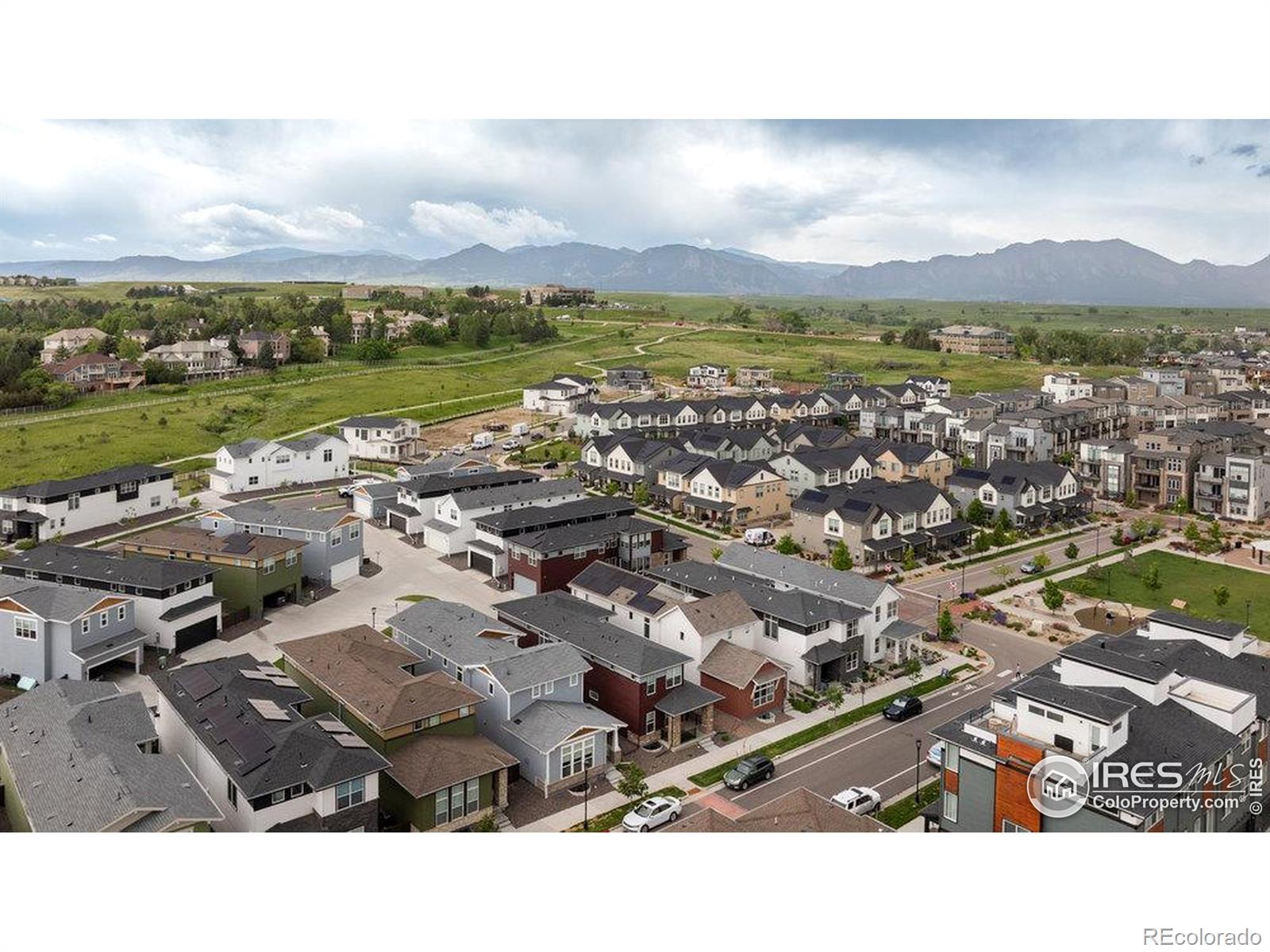 730 Promenade Drive Superior, CO 80027 - Photo 45 of 50 an aerial view of a city with lots of residential buildings and mountain view in back