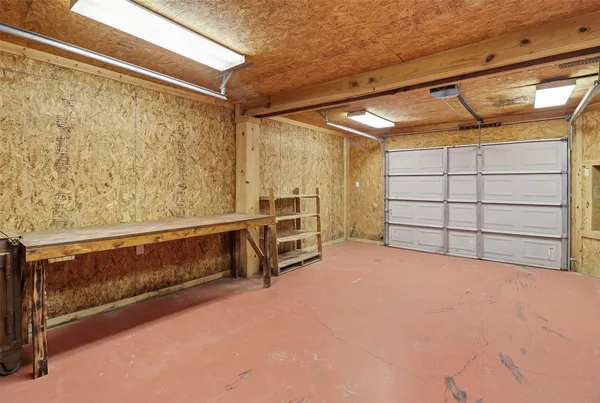 a view of an empty room with storage