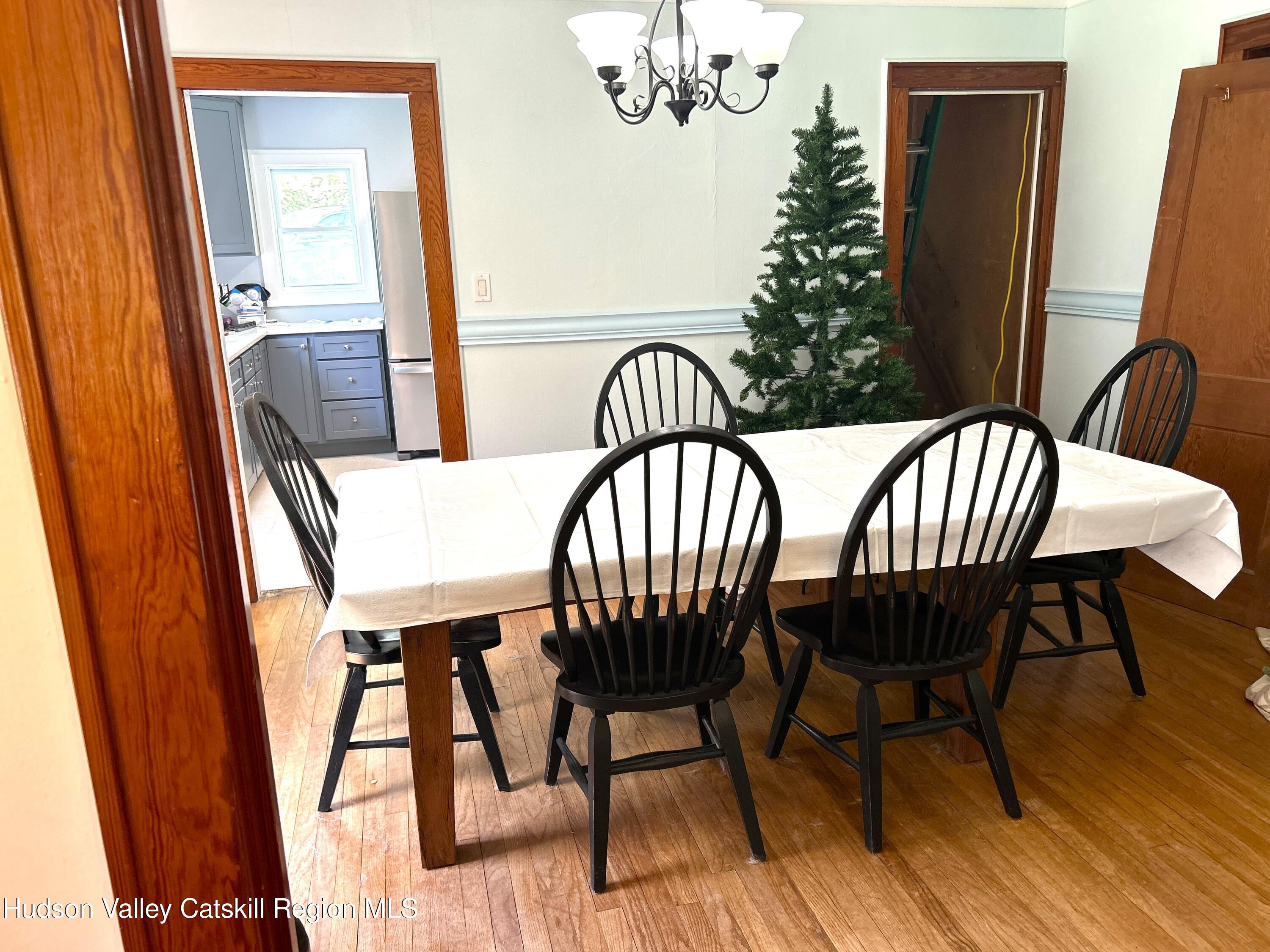 169 Rt 4 Prattsville, NY 12468 - Photo 12 of 35 a view of a dining room with furniture and wooden floor