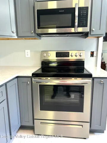 a kitchen with a sink and a window