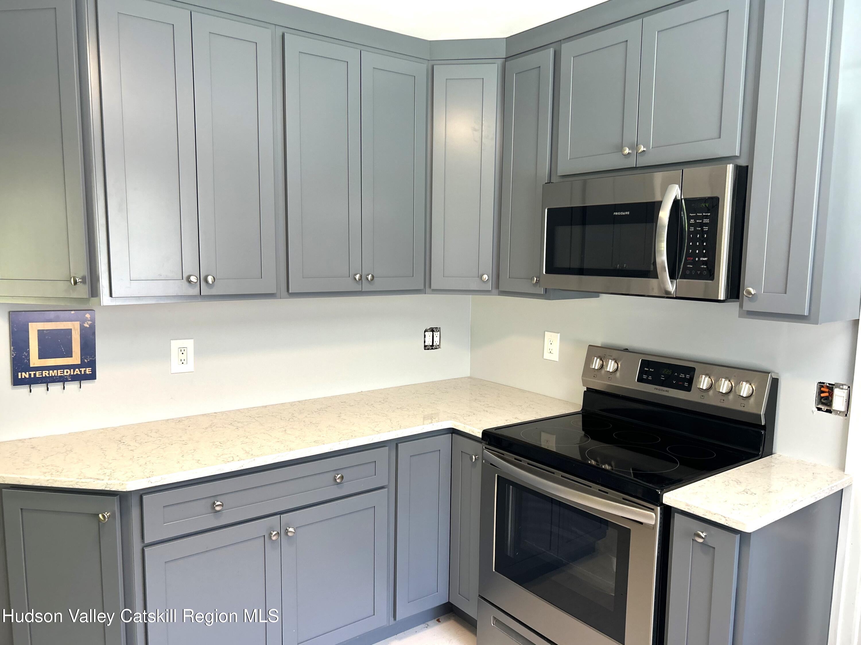 169 Rt 4 Prattsville, NY 12468 - Photo 17 of 35 a kitchen with granite countertop cabinets stainless steel appliances and wooden cabinets