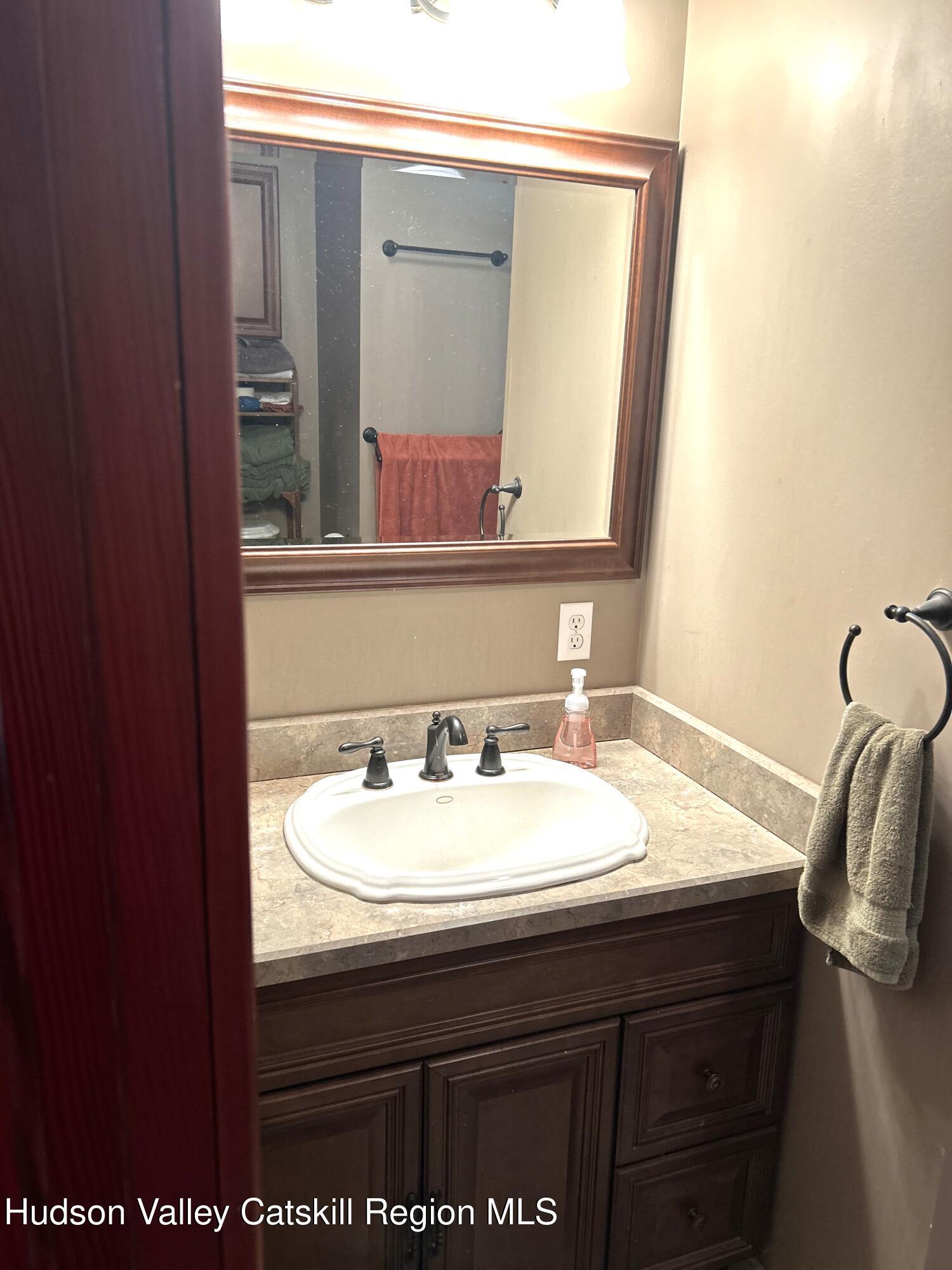 169 Rt 4 Prattsville, NY 12468 - Photo 22 of 35 a bathroom with a sink and a mirror