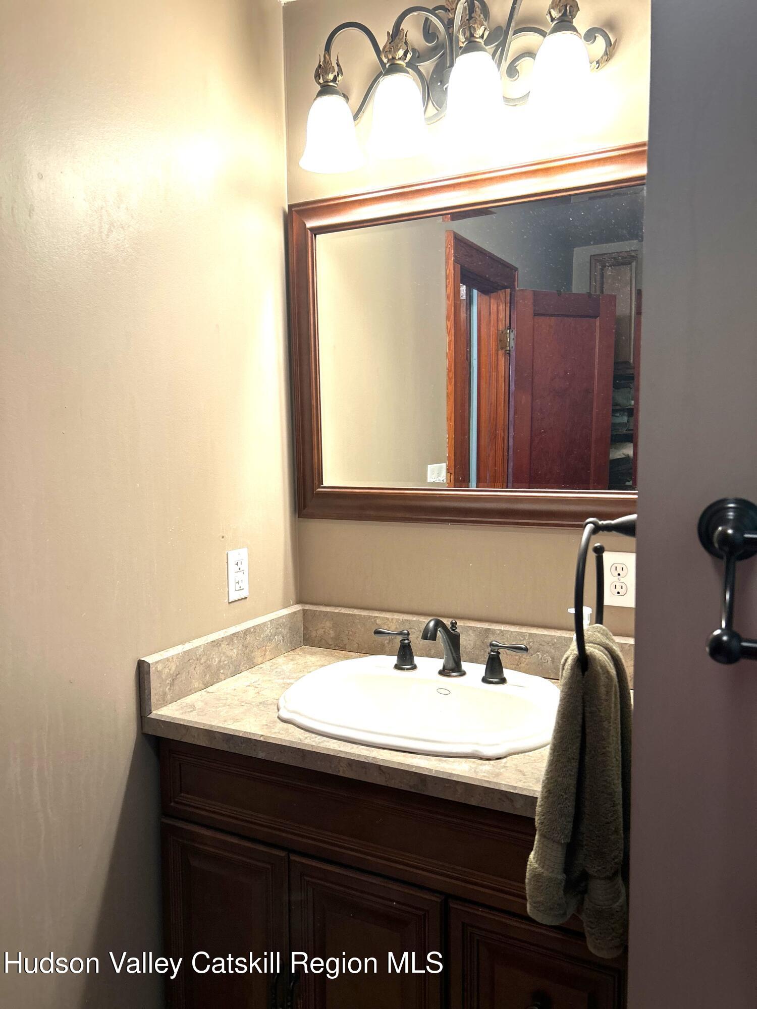 169 Rt 4 Prattsville, NY 12468 - Photo 23 of 35 a bathroom with a sink and a mirror