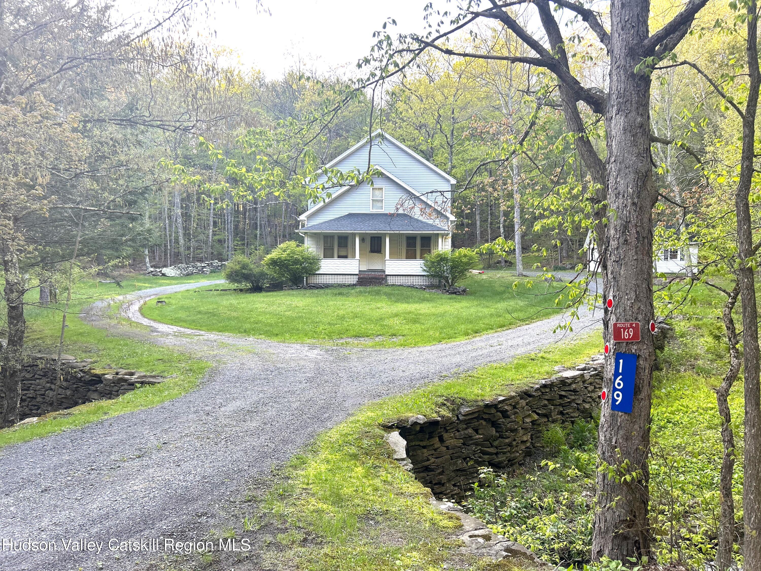 169 Rt 4 Prattsville, NY 12468 - Photo 4 of 35 a front view of a house with yard and green space