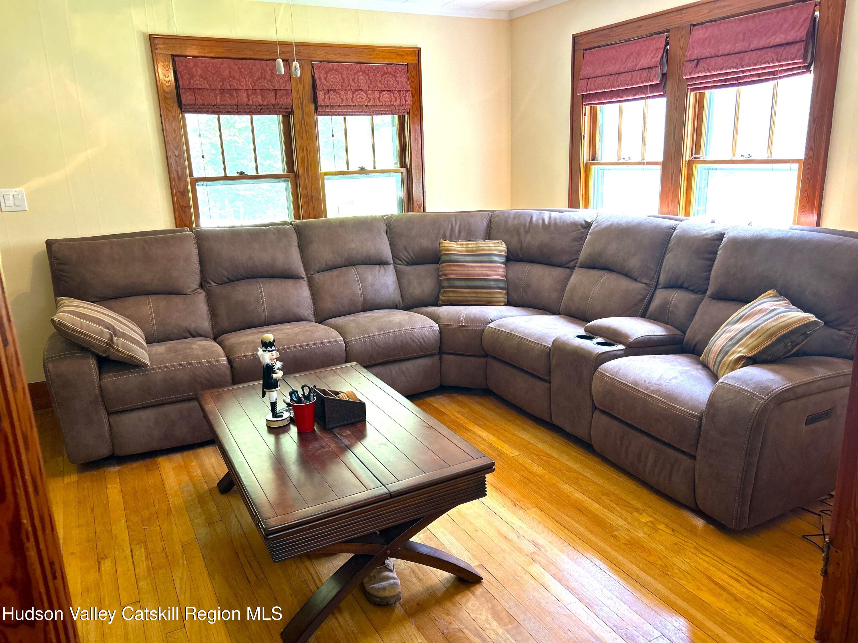 169 Rt 4 Prattsville, NY 12468 - Photo 7 of 35 a living room with furniture wooden floor and a window