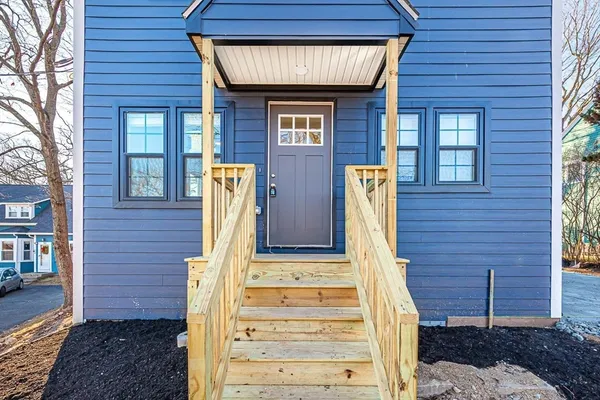 a front view of a house with stairs