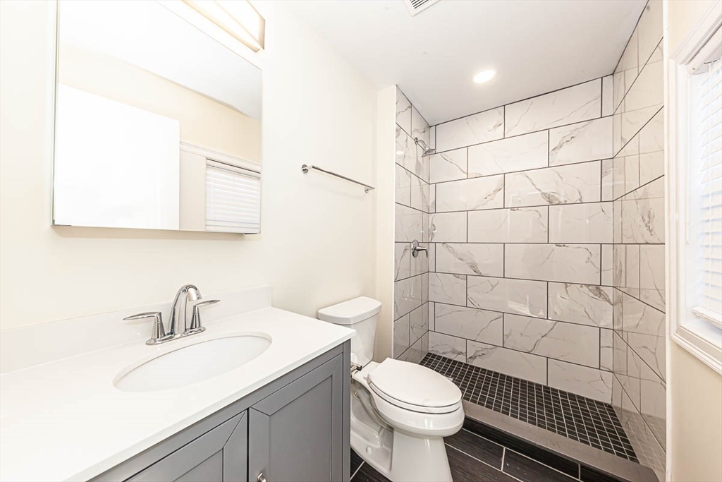 48 Caldwell Road, Unit 48 Waltham, MA 02453 - Photo 10 of 38 a bathroom with a sink toilet and shower