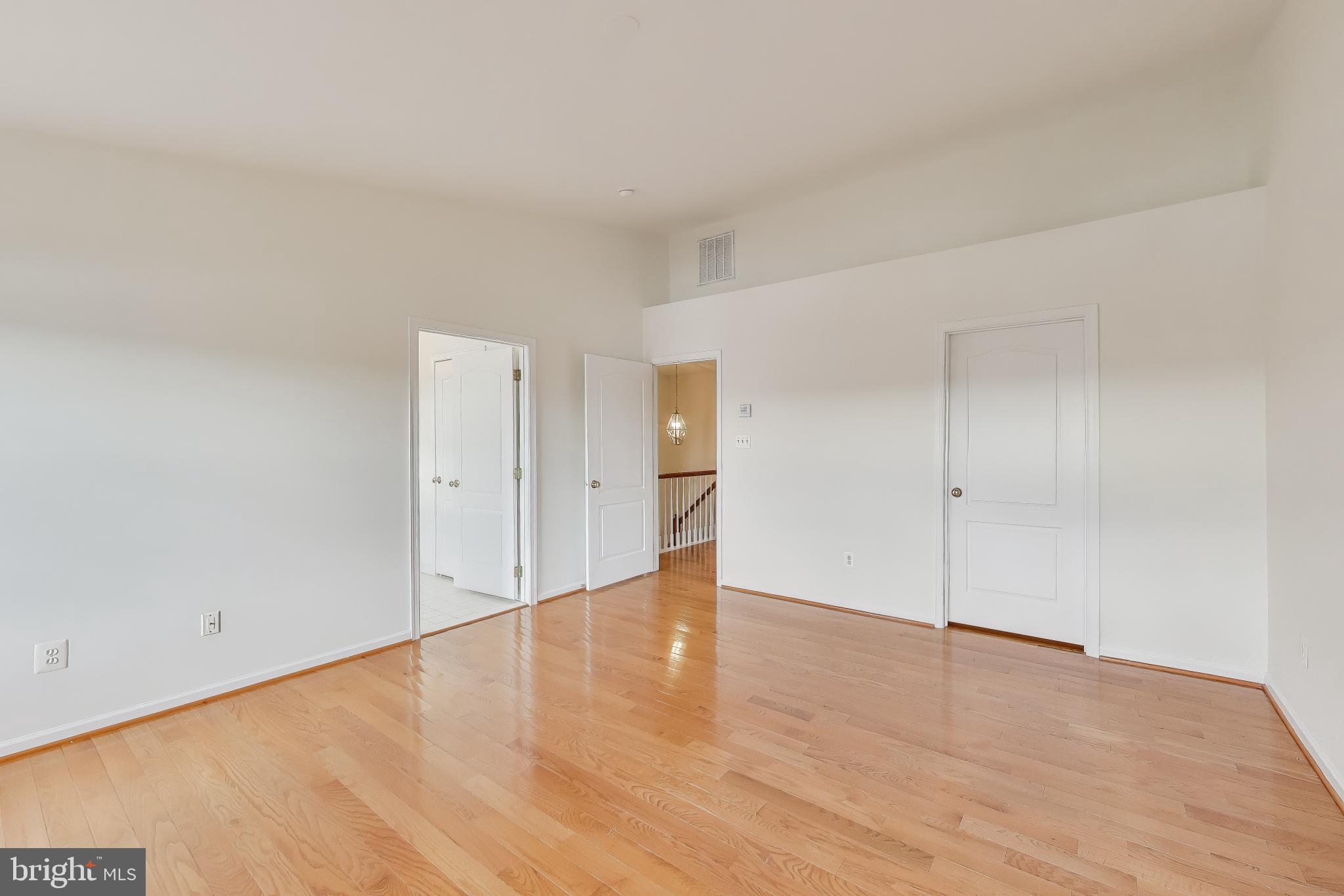 42759 Locklear Terrace Chantilly, VA 20152 - Photo 21 of 38 a view of an empty room and wooden floor