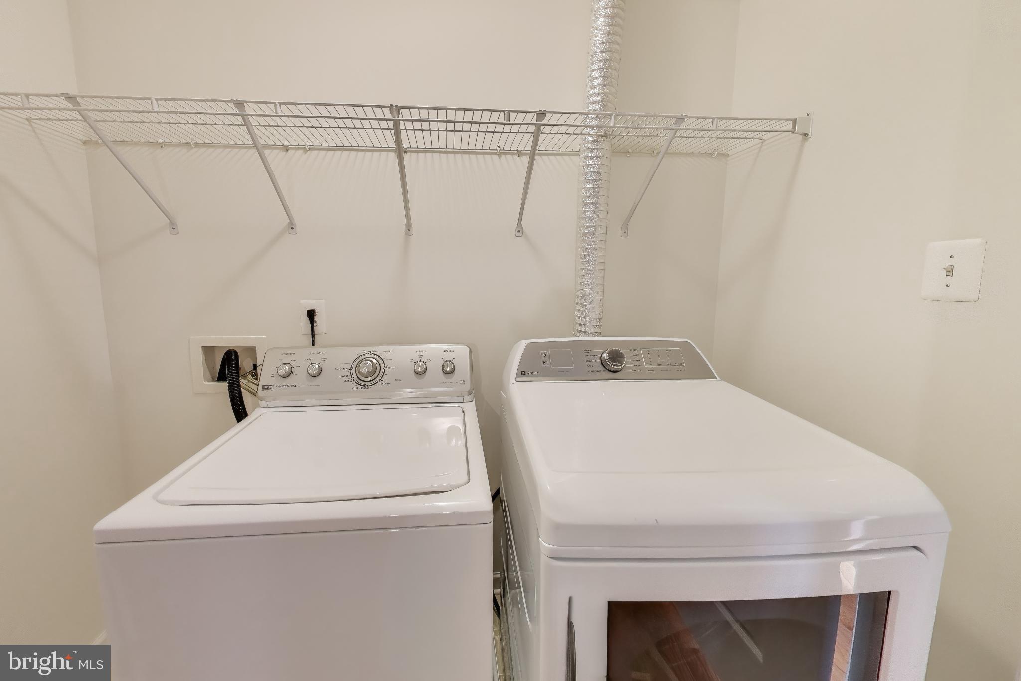 42759 Locklear Terrace Chantilly, VA 20152 - Photo 30 of 38 a utility room with dryer and washer