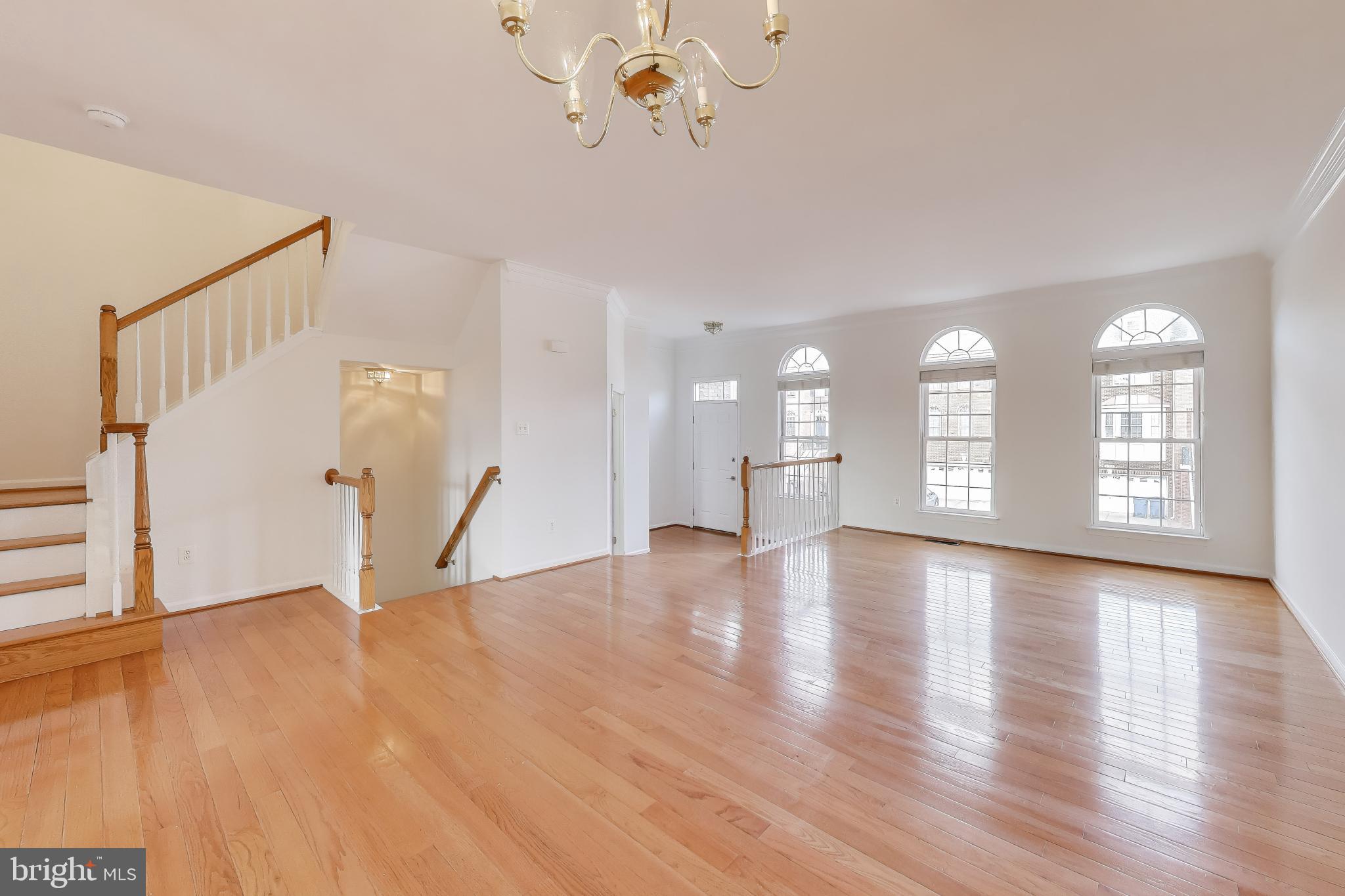 42759 Locklear Terrace Chantilly, VA 20152 - Photo 3 of 38 a view of an empty room with wooden floor and a window