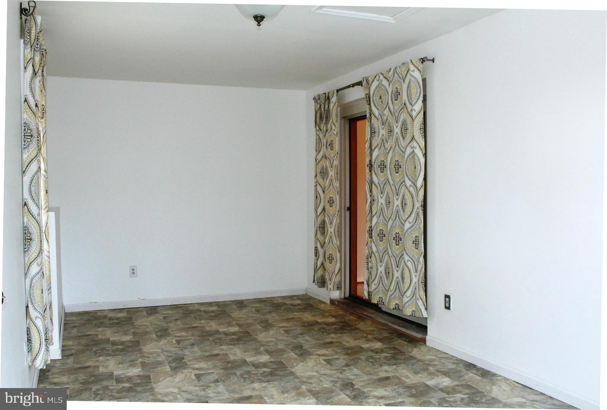 6623 Huntsman Boulevard Springfield, VA 22152 - Photo 11 of 26 Den with sliding glass door to kitchen