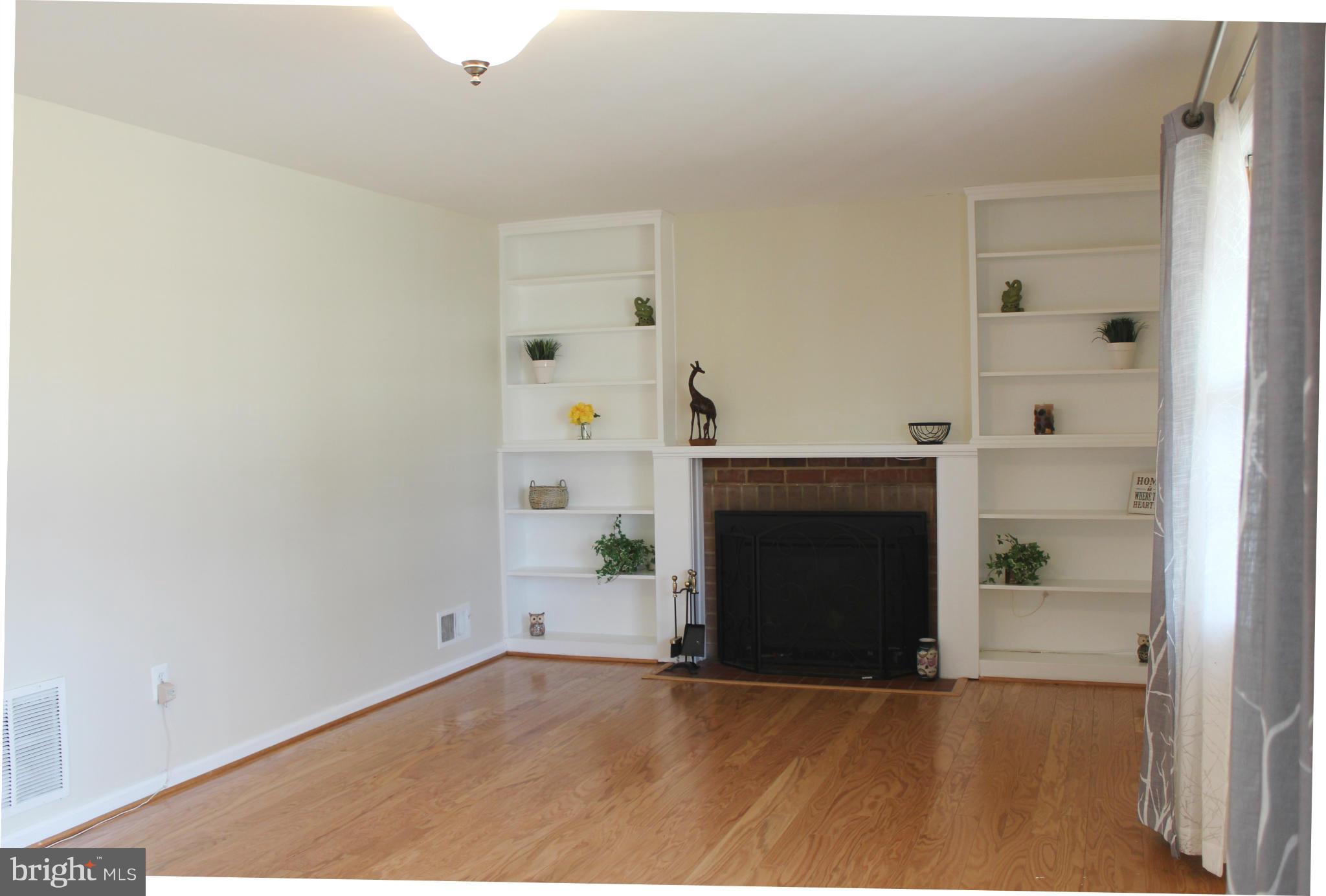 6623 Huntsman Boulevard Springfield, VA 22152 - Photo 4 of 26 Family Room w/gas fireplace and built-in shelves