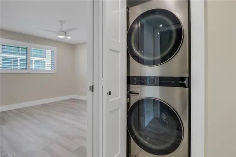 a close view of a utility room with dryer and washer