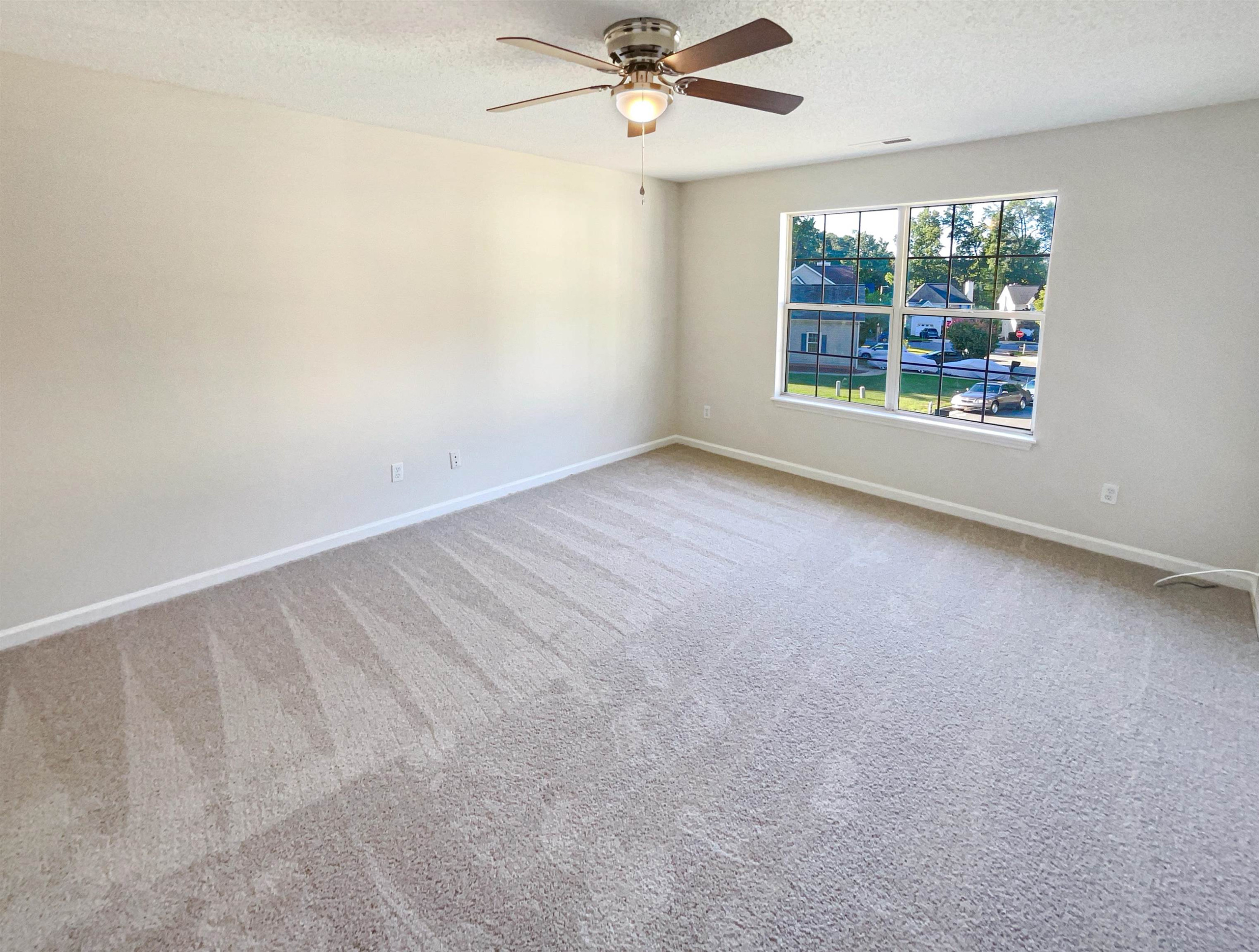 7416 Wisconsin Court Raleigh, NC 27615 - Photo 5 of 17 an empty room with a window