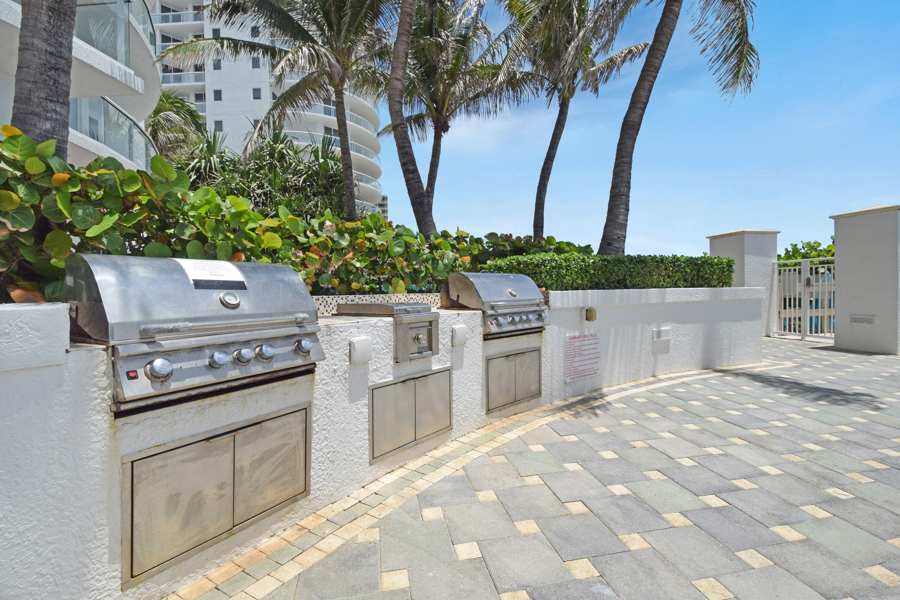 4600 North Ocean Drive, Unit 406 Singer Island, FL 33404 - Photo 104 of 106 a view of a kitchen with seating area and trees
