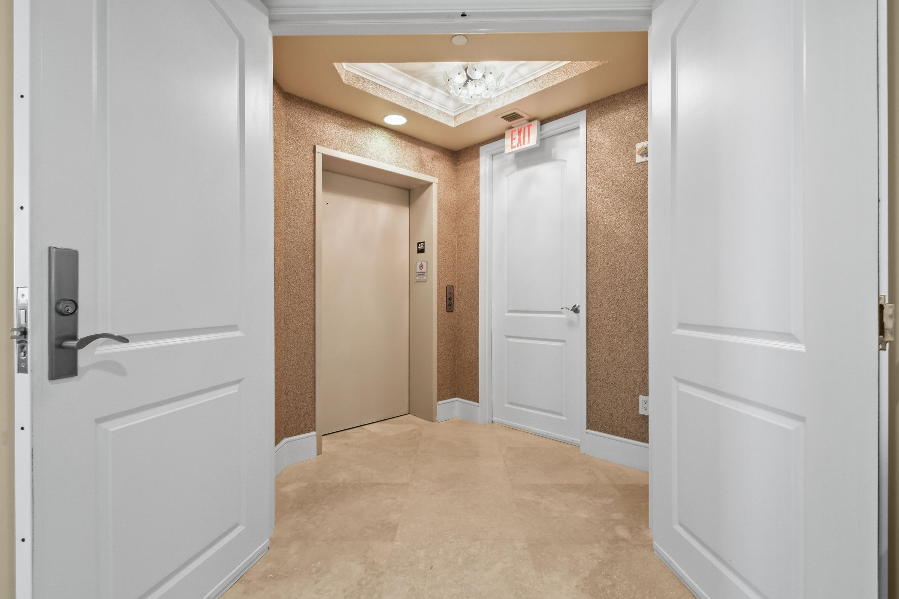 4600 North Ocean Drive, Unit 406 Singer Island, FL 33404 - Photo 3 of 106 a view of a hallway with a elevator