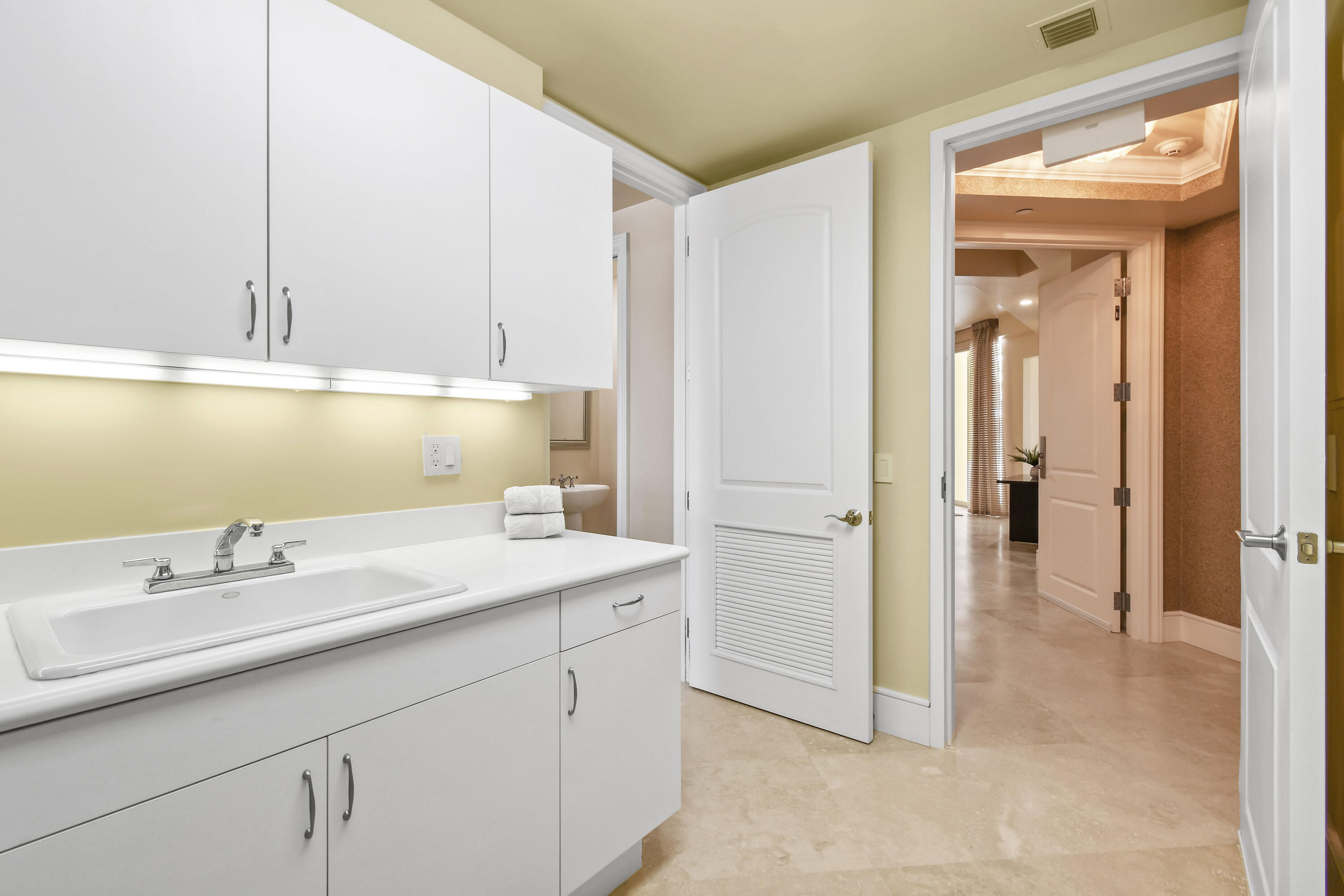 4600 North Ocean Drive, Unit 406 Singer Island, FL 33404 - Photo 34 of 106 a bathroom with a sink and a mirror