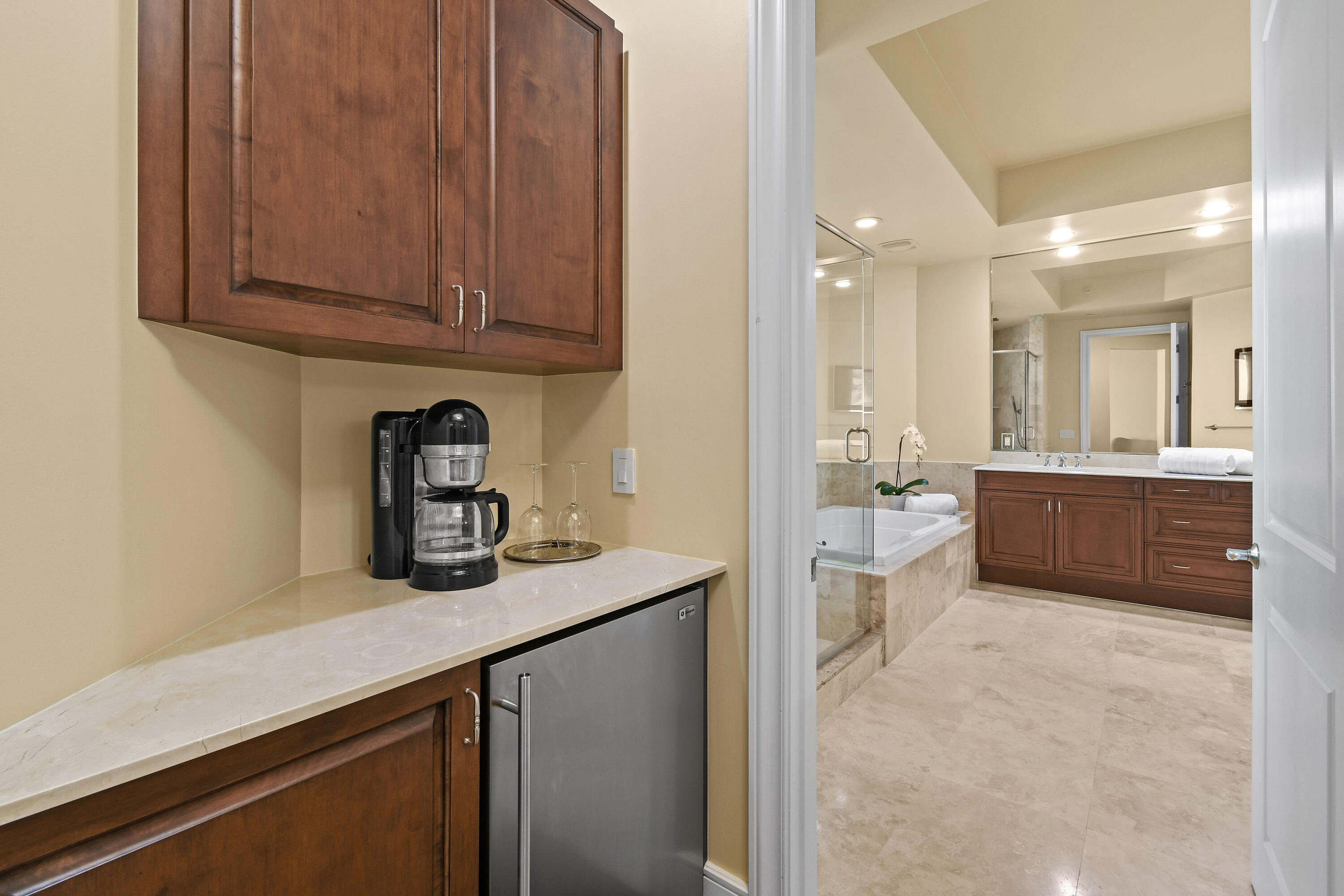 4600 North Ocean Drive, Unit 406 Singer Island, FL 33404 - Photo 44 of 106 a kitchen with stainless steel appliances granite countertop a sink stove and cabinets