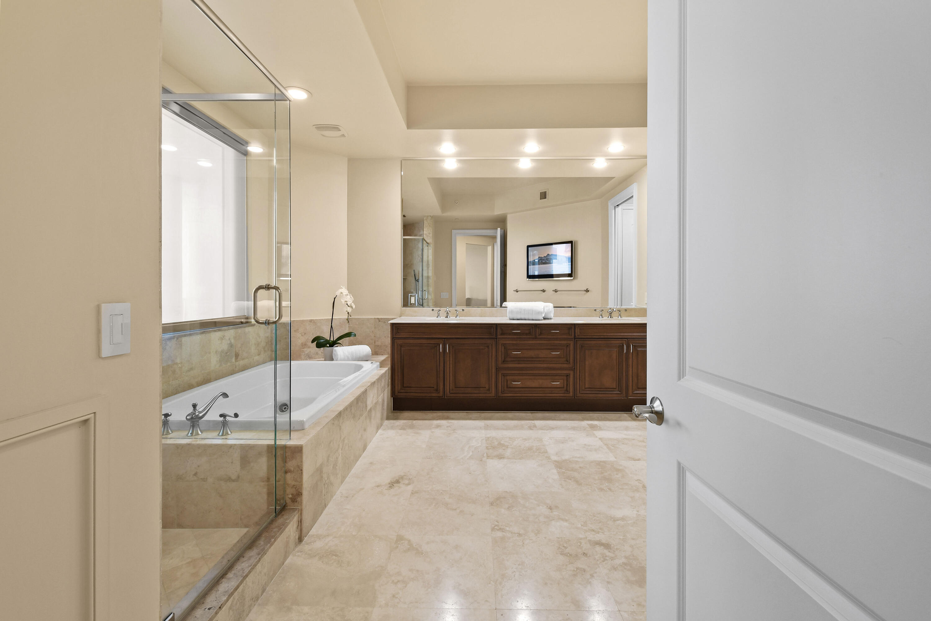 4600 North Ocean Drive, Unit 406 Singer Island, FL 33404 - Photo 45 of 106 a spacious bathroom with a double vanity sink large mirror and bathtub