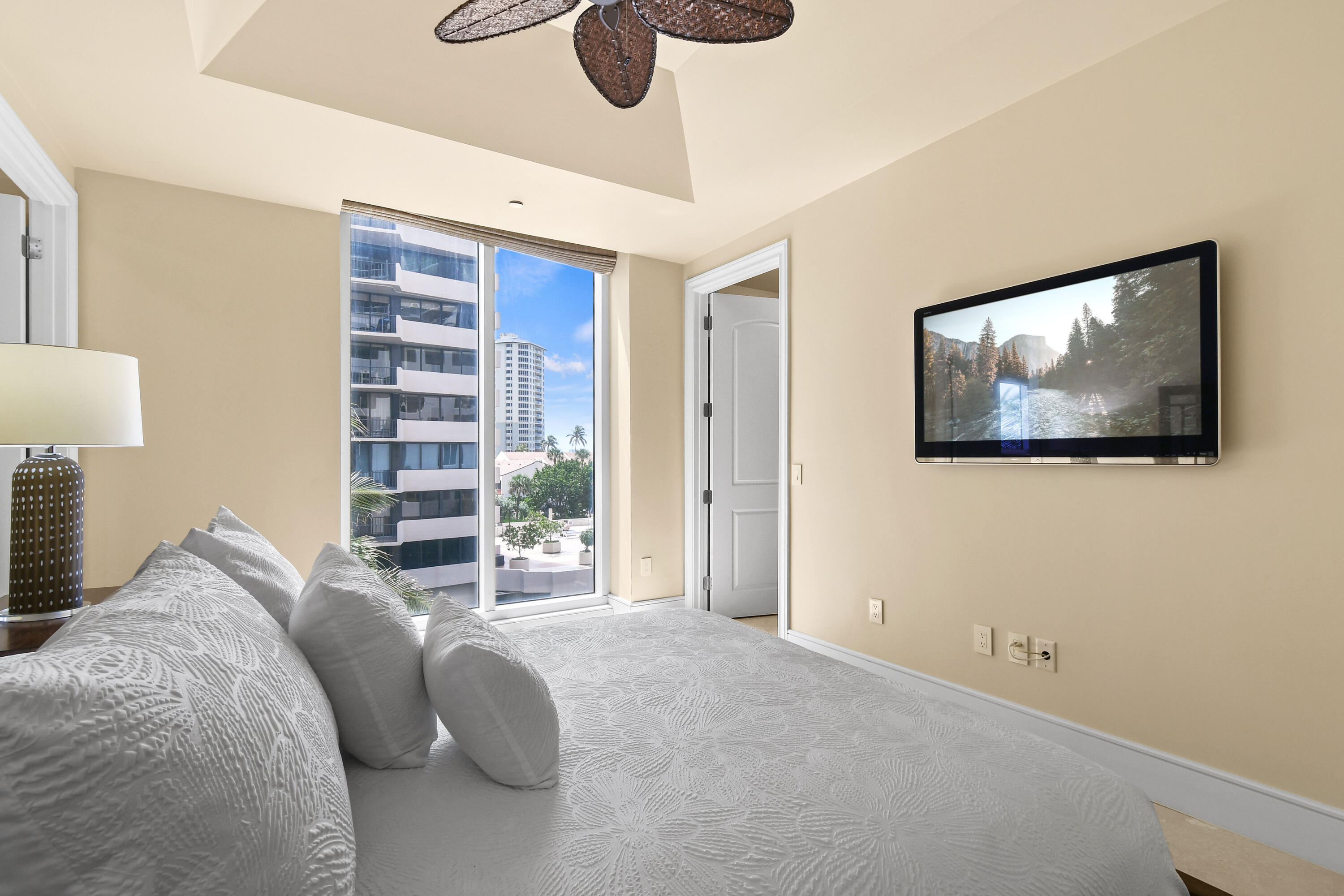 4600 North Ocean Drive, Unit 406 Singer Island, FL 33404 - Photo 56 of 106 a bedroom with a bed and a painting on the wall