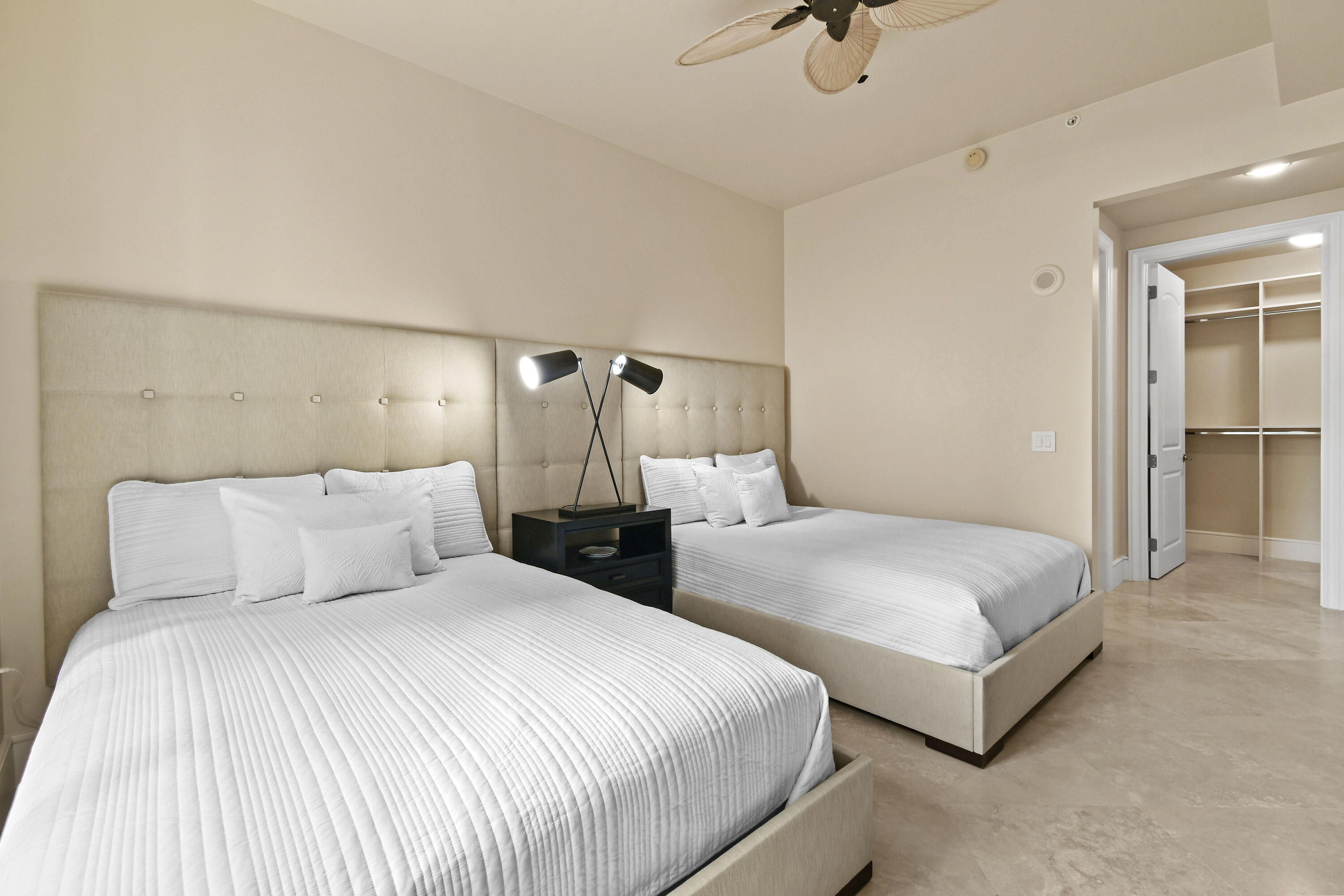 4600 North Ocean Drive, Unit 406 Singer Island, FL 33404 - Photo 63 of 106 a bedroom with two beds and painted walls