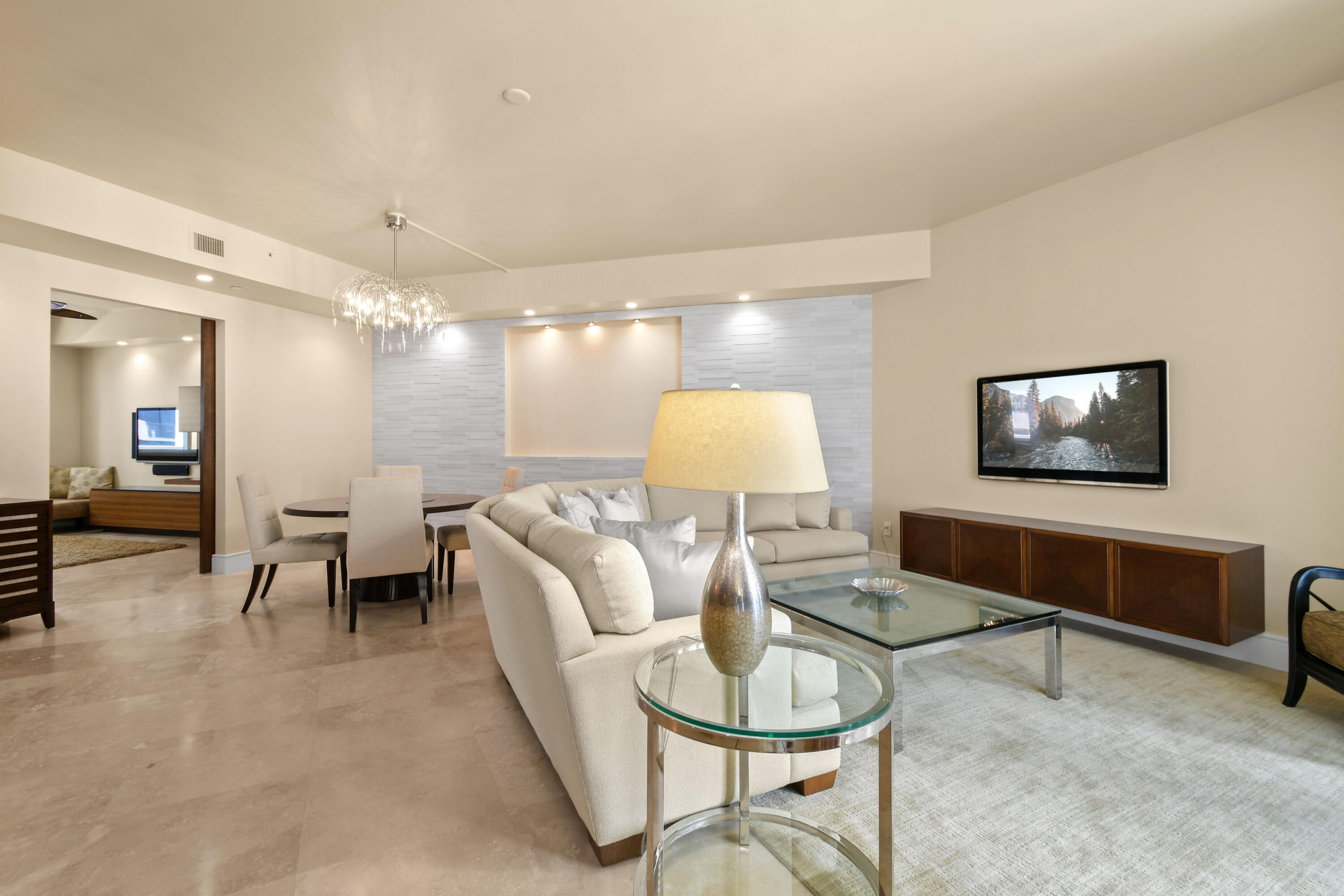 4600 North Ocean Drive, Unit 406 Singer Island, FL 33404 - Photo 7 of 106 a living room with furniture and a flat screen tv