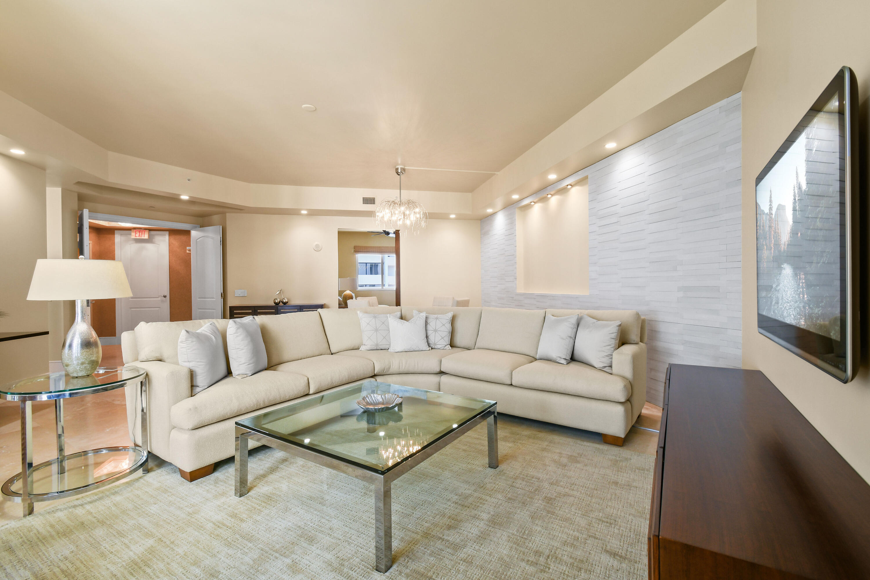 4600 North Ocean Drive, Unit 406 Singer Island, FL 33404 - Photo 8 of 106 a living room with furniture and a flat screen tv