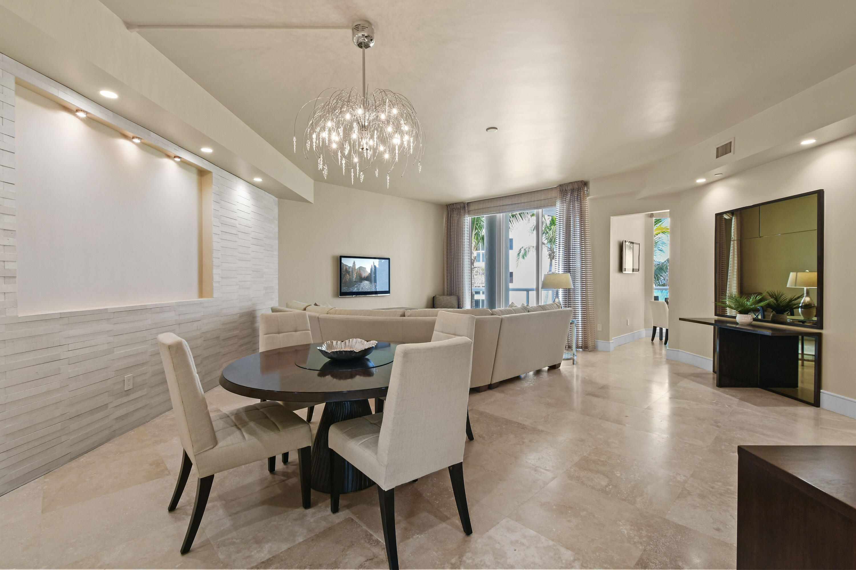 4600 North Ocean Drive, Unit 406 Singer Island, FL 33404 - Photo 10 of 106 a view of a dining room with furniture and wooden floor