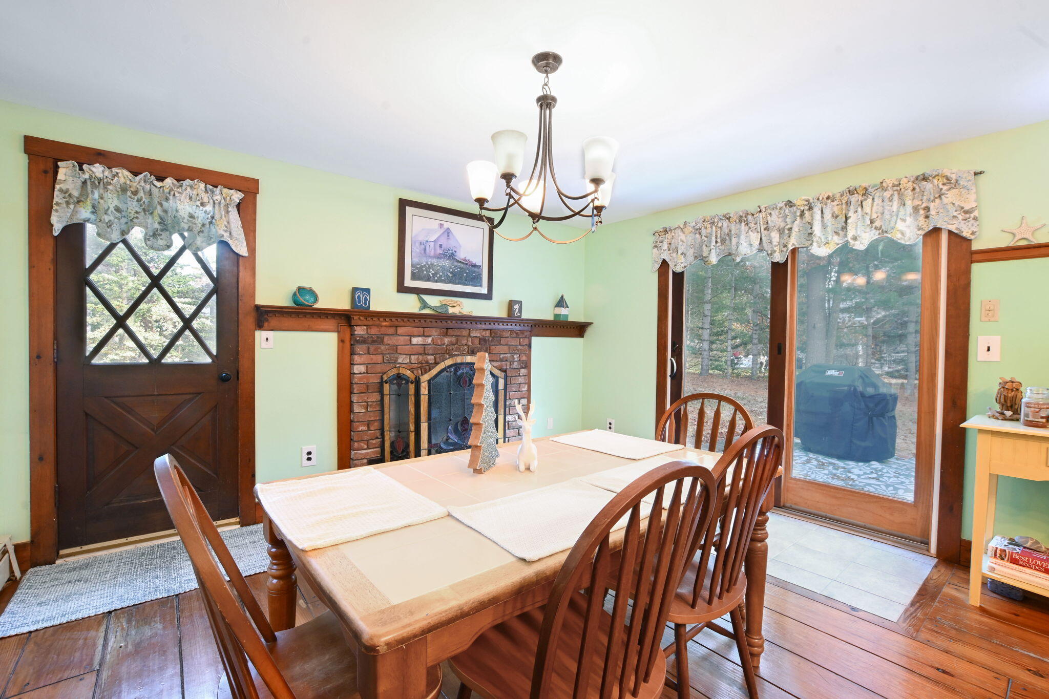 23 Old Fields Road Sandwich, MA 02563 - Photo 11 of 26 a view of a dining room with furniture window and wooden floor