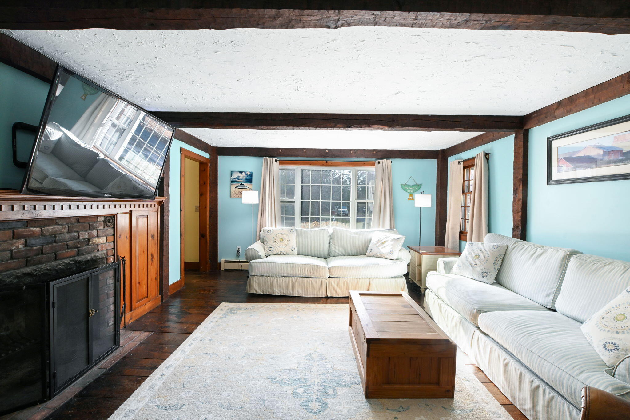23 Old Fields Road Sandwich, MA 02563 - Photo 7 of 26 a living room with furniture and a fireplace