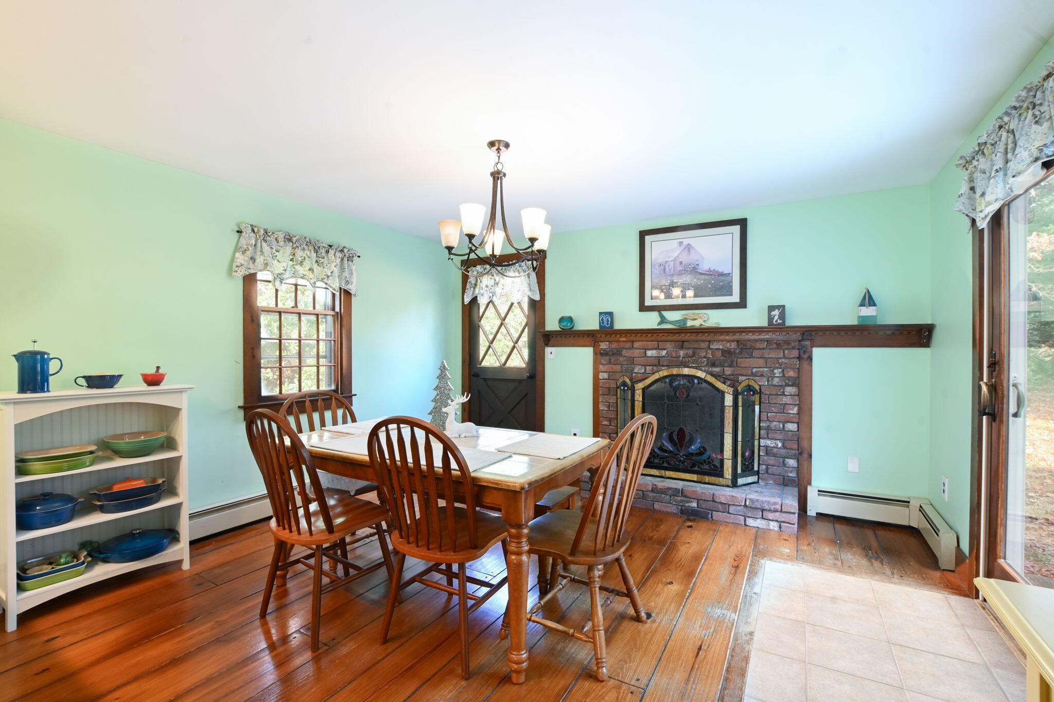 23 Old Fields Road Sandwich, MA 02563 - Photo 10 of 26 a view of a dining room with furniture and a chandelier