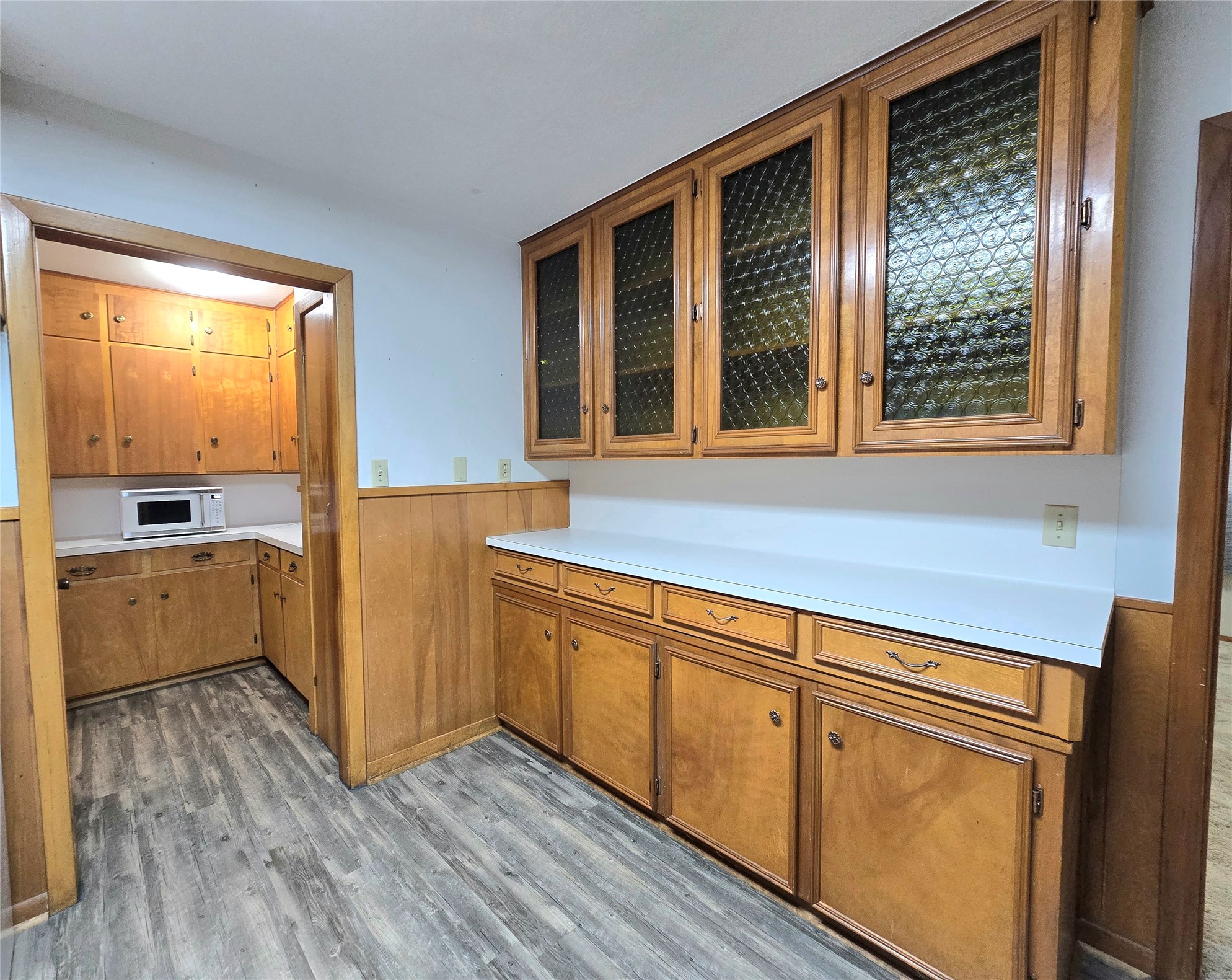 607 South Main Street Dayton, TX 77535 - Photo 12 of 39 a view of a kitchen with wooden floor and a window