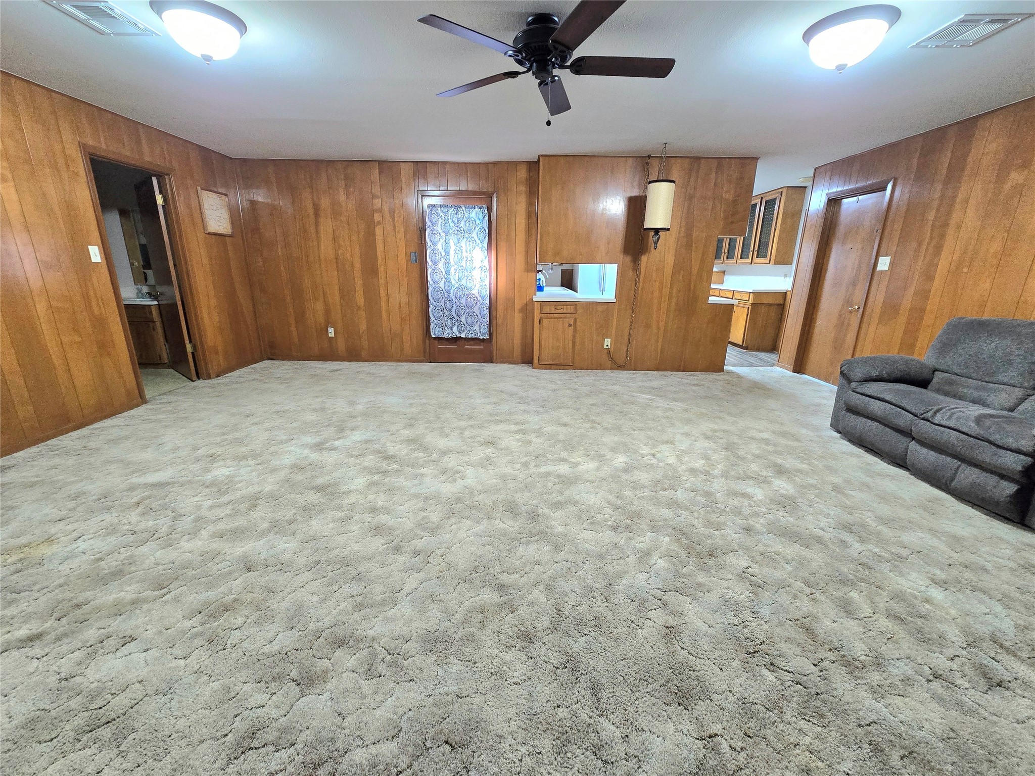 607 South Main Street Dayton, TX 77535 - Photo 16 of 39 a view of a livingroom with a dishwasher and furniture