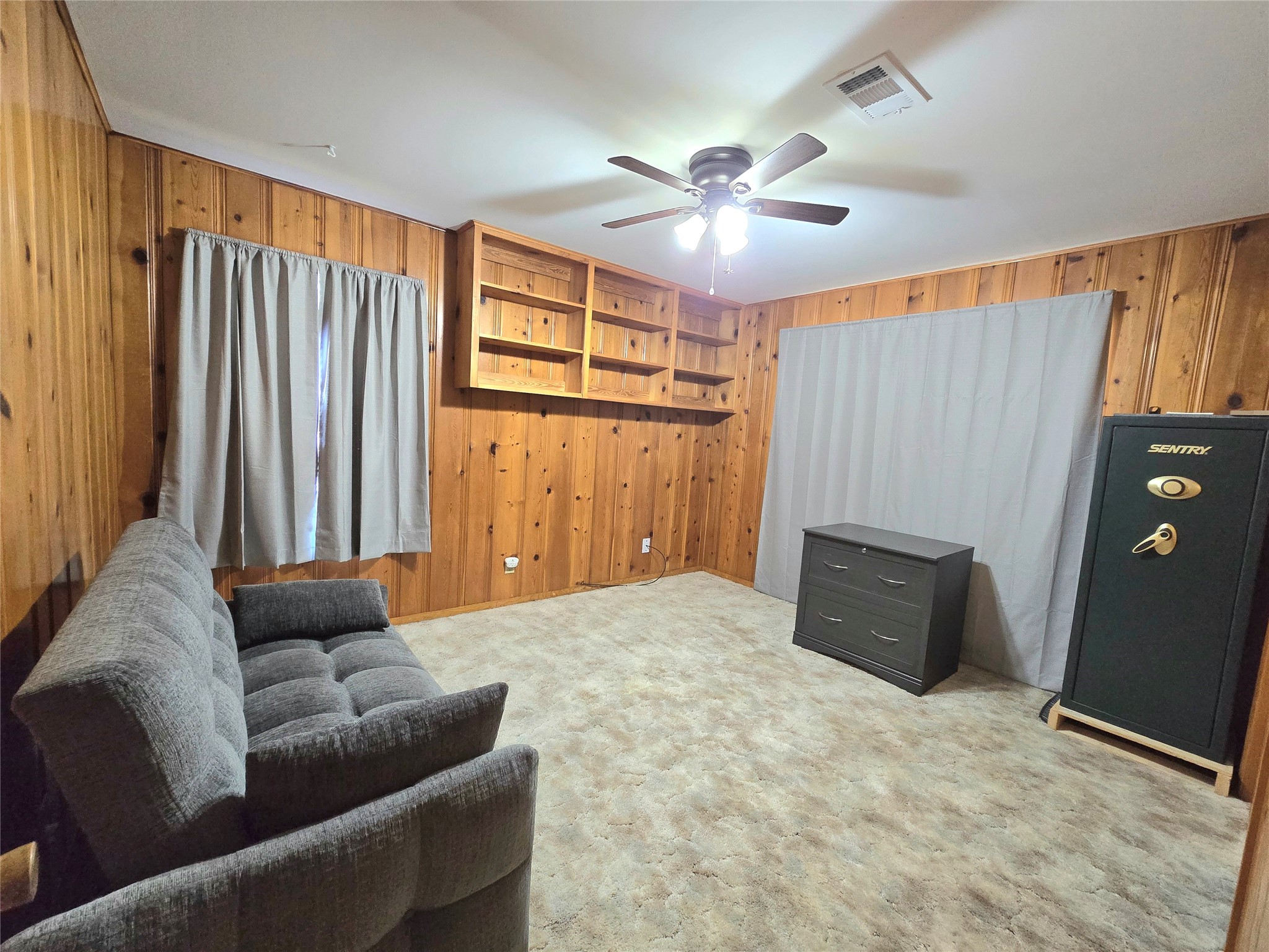 607 South Main Street Dayton, TX 77535 - Photo 23 of 39 a living room with furniture and a window