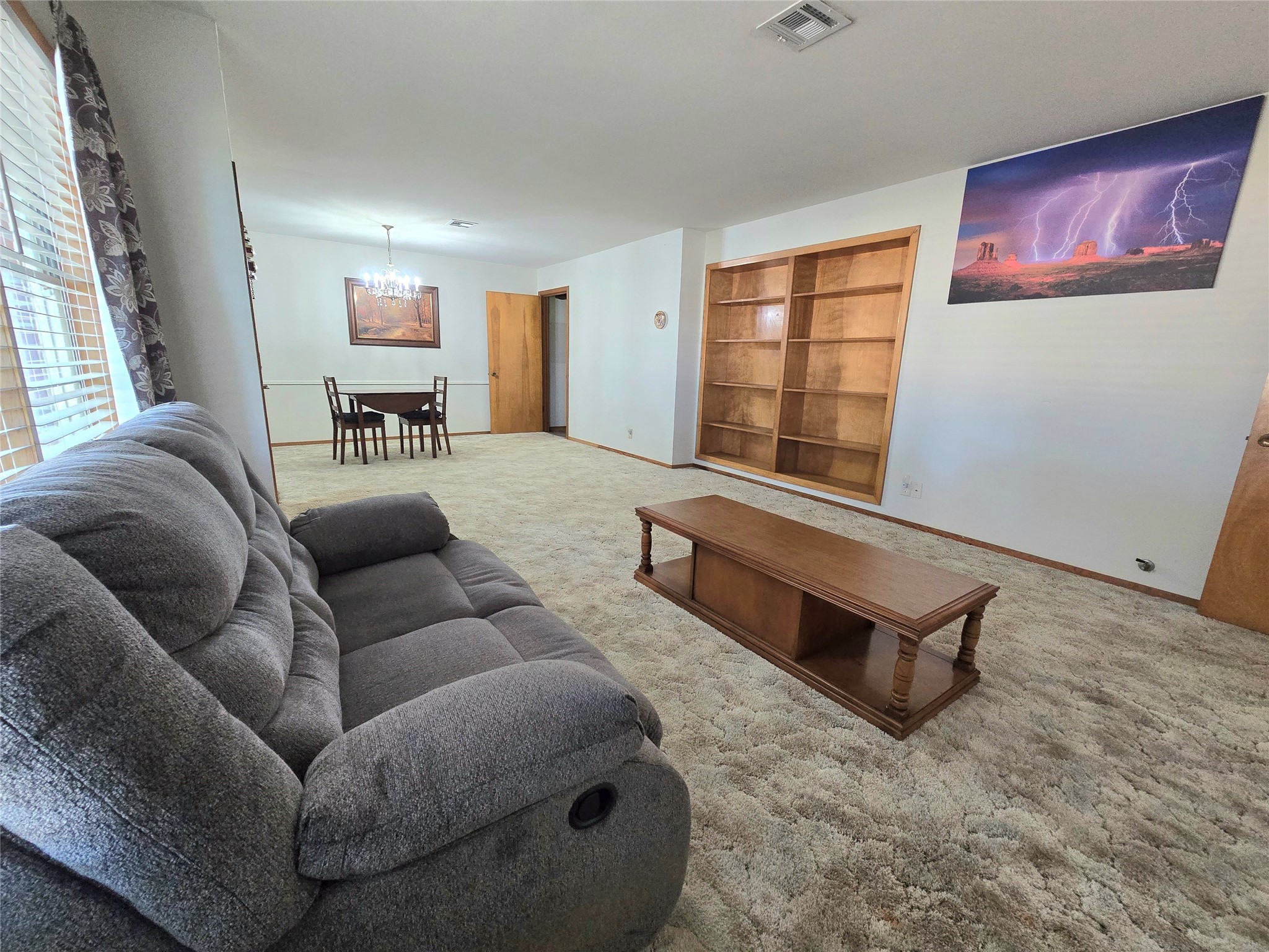 607 South Main Street Dayton, TX 77535 - Photo 3 of 39 a living room with furniture and a window