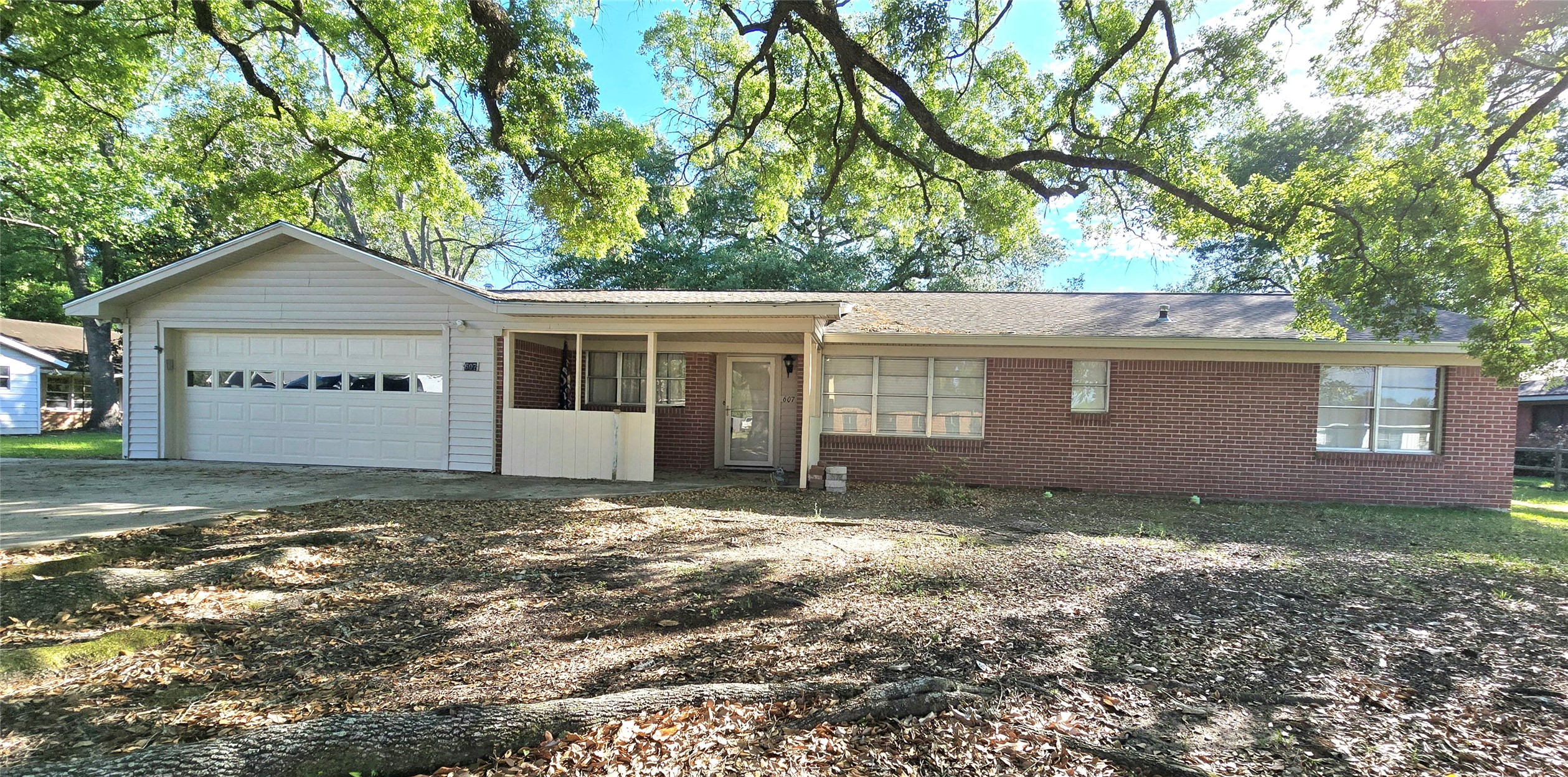 607 South Main Street Dayton, TX 77535 - Photo 32 of 39 a view of a house with a yard