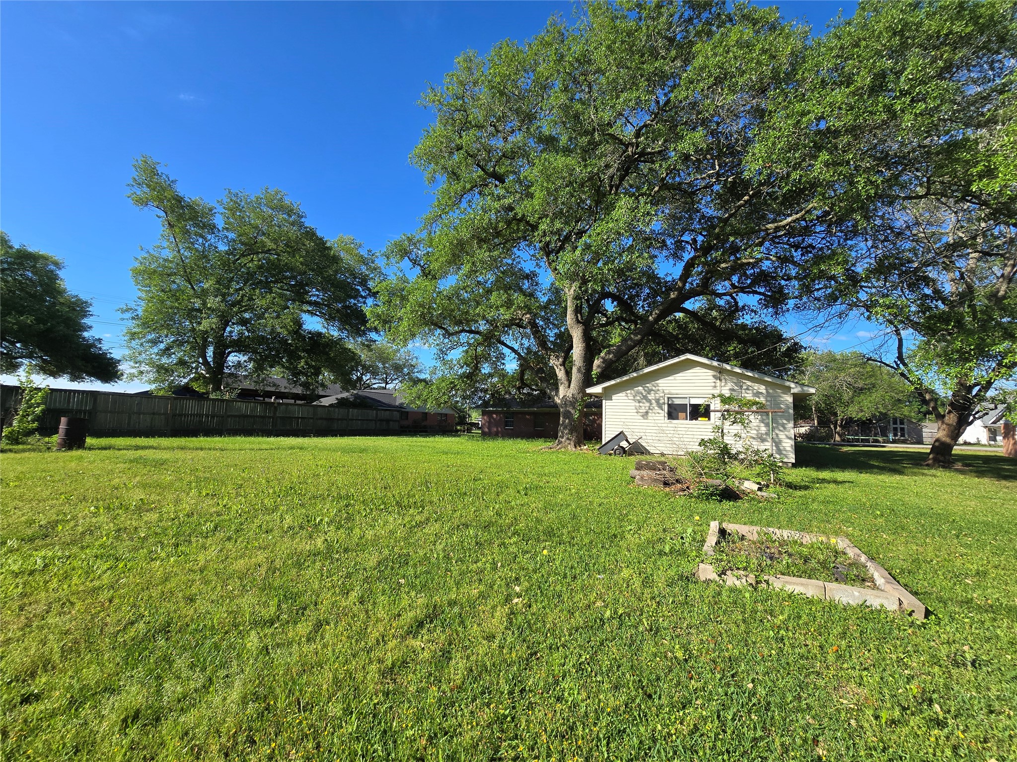 607 South Main Street Dayton, TX 77535 - Photo 36 of 39 a view of a backyard
