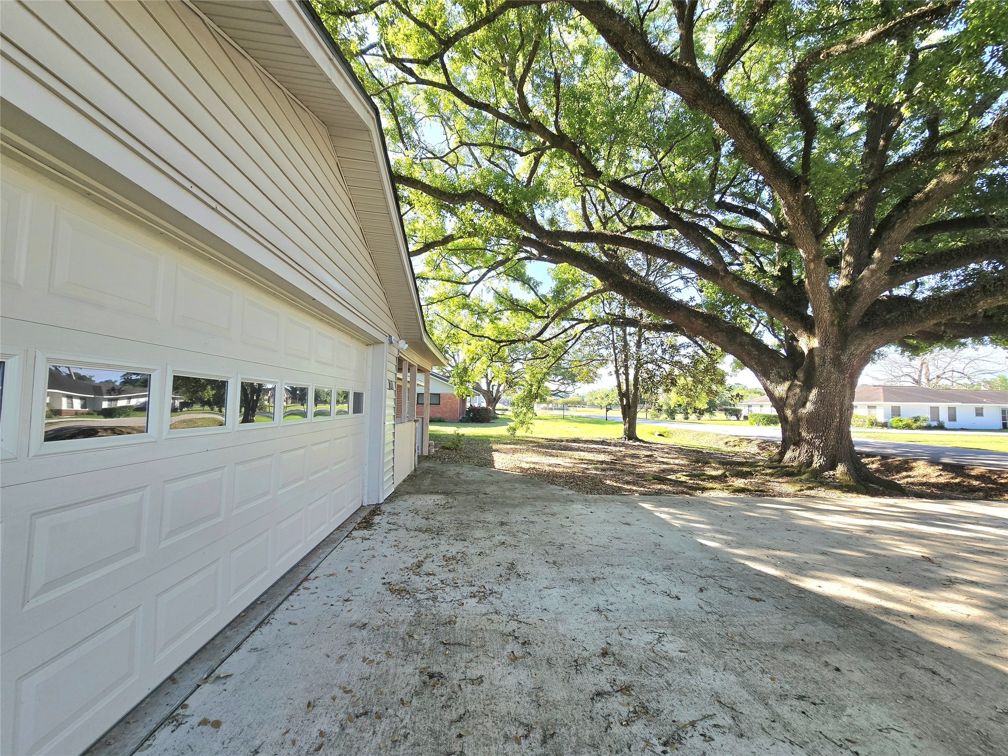607 South Main Street Dayton, TX 77535 - Photo 37 of 39 a view of a road with large trees