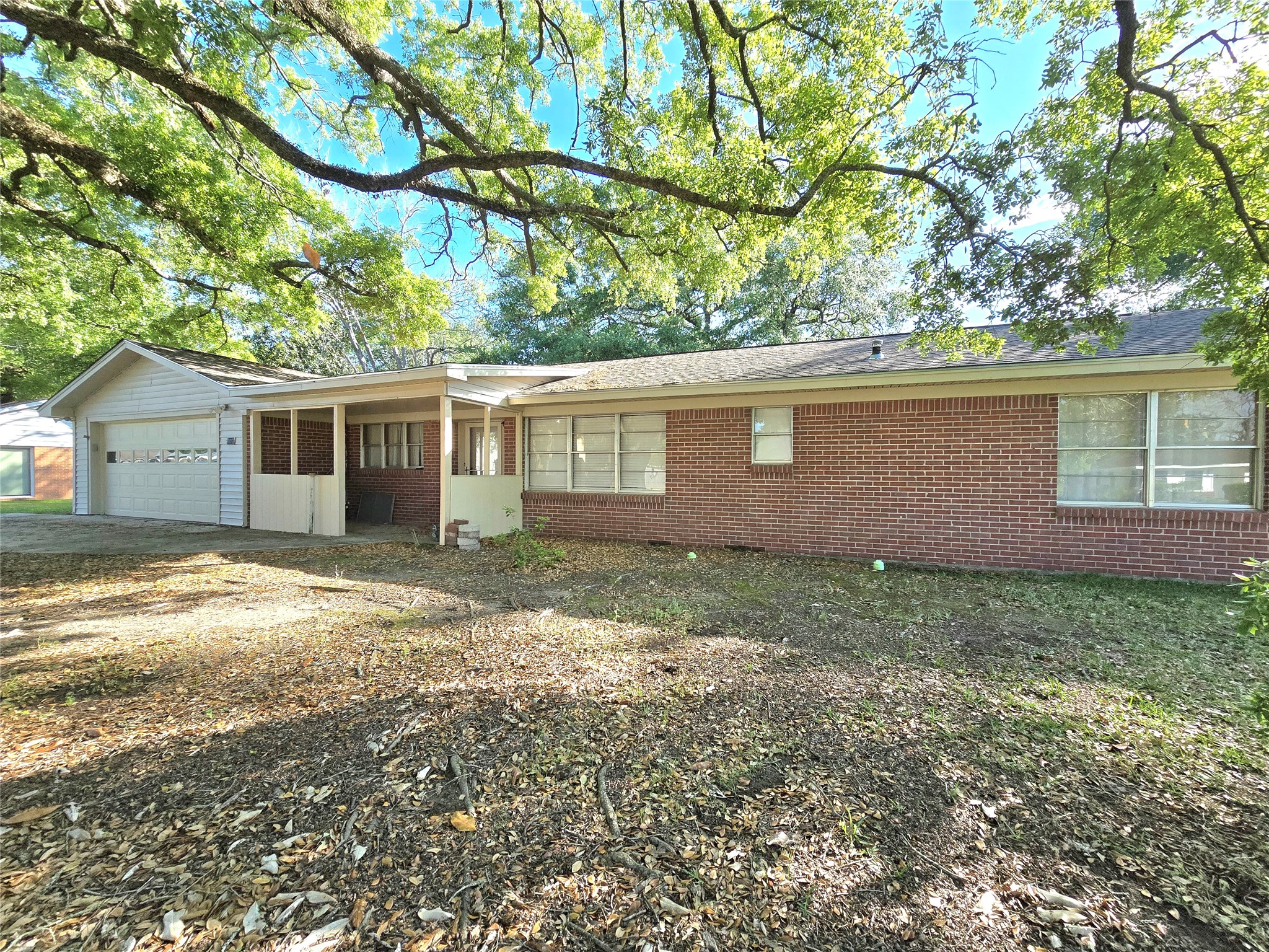 607 South Main Street Dayton, TX 77535 - Photo 39 of 39 a view of house with backyard