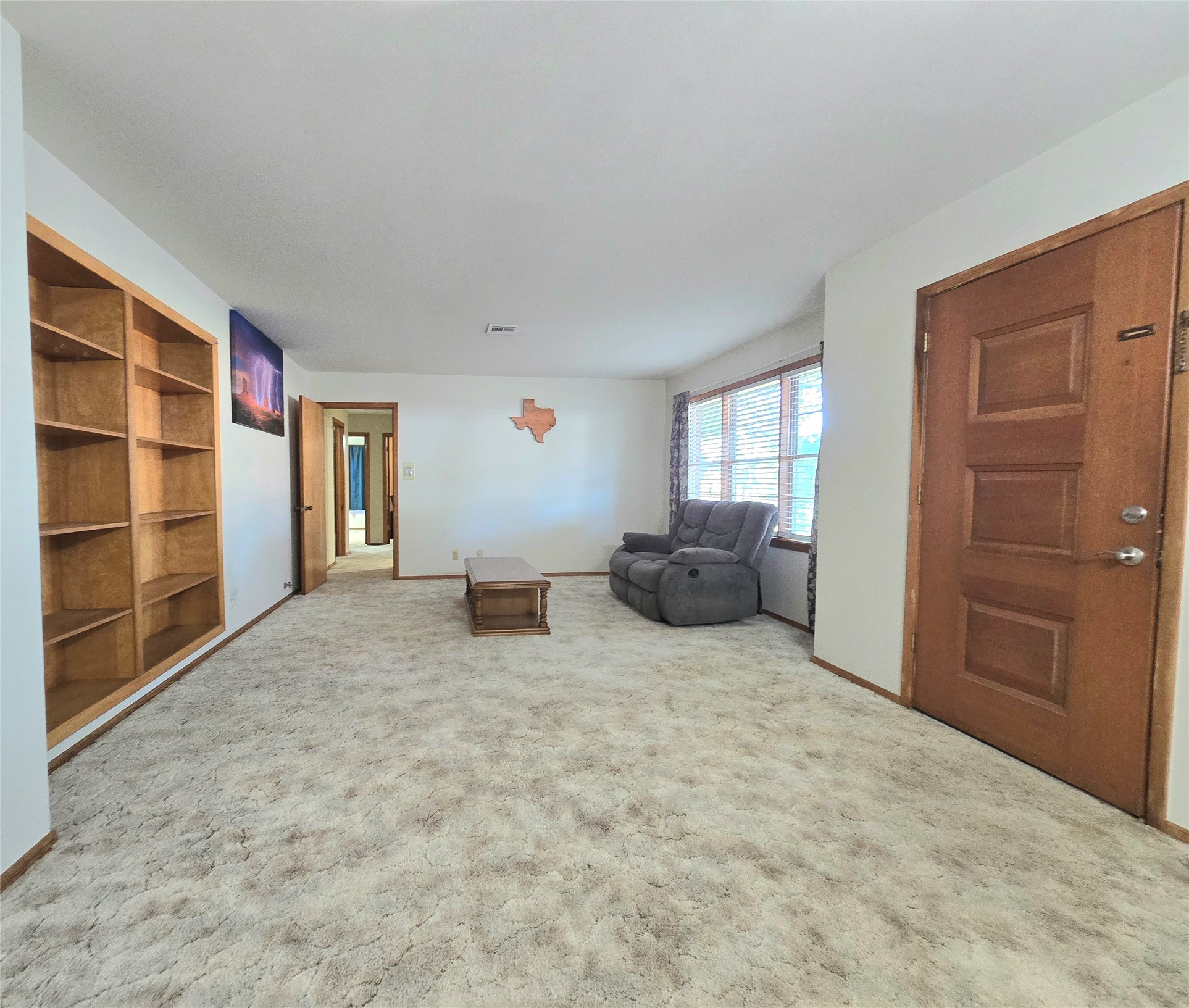 607 South Main Street Dayton, TX 77535 - Photo 6 of 39 a large bedroom with a bed and furniture