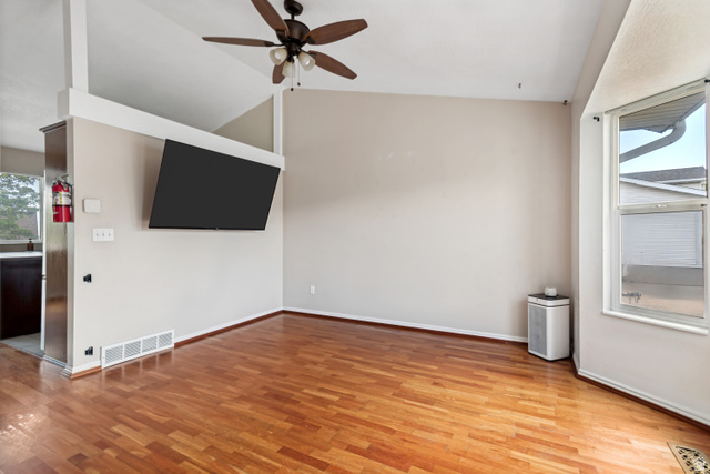 843 Deer Flat Road Tooele, UT 84074 - Photo 6 of 27 Living space featuring wood-finish flooring, vaulted ceilings, and a ceiling fan