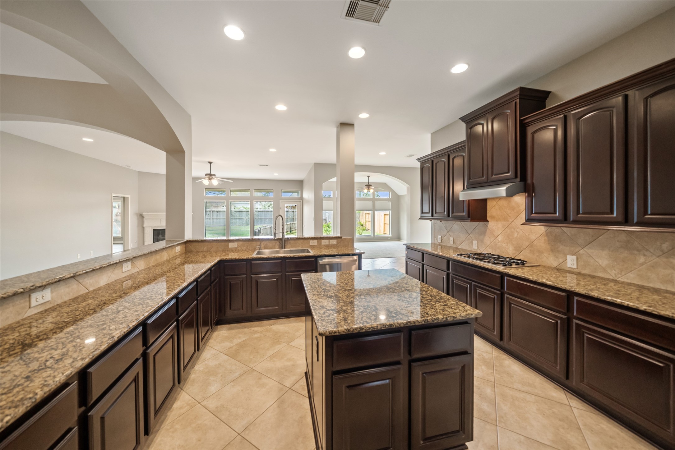 2818 Red Maple Drive Katy, TX 77494 - Photo 11 of 50 a large kitchen with granite countertop lots of counter space and sink