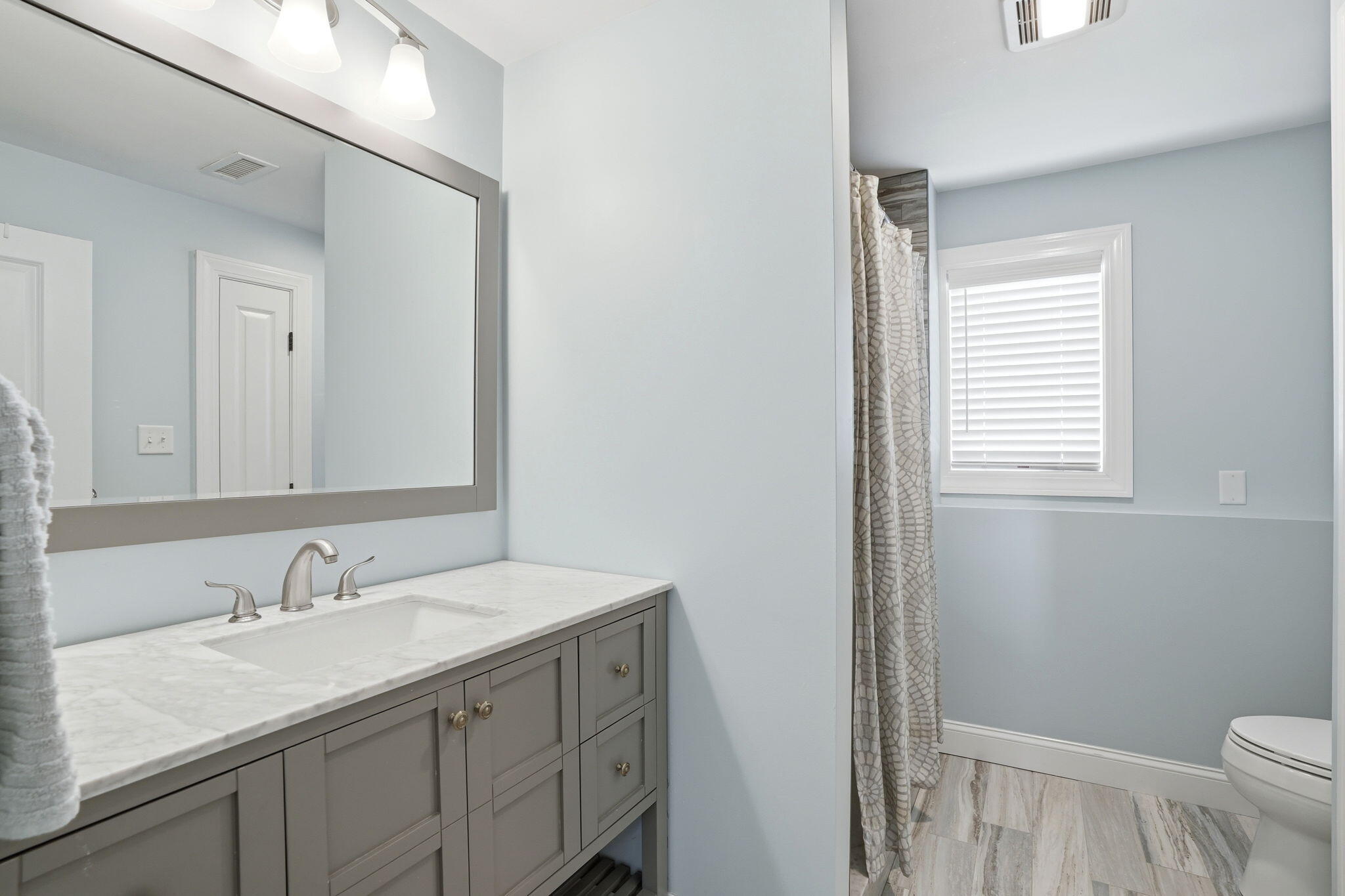 4 Cross Road Bourne, MA 02532 - Photo 30 of 47 a bathroom with a granite countertop sink toilet and a mirror