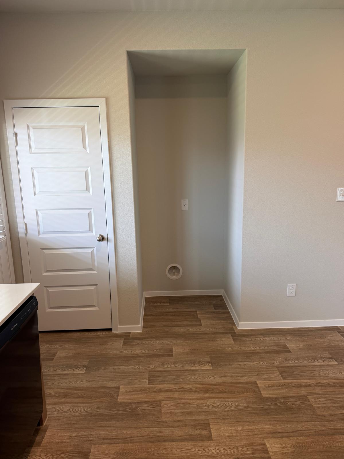 2701 Towy Road Manor, TX 78653 - Photo 20 of 35 Functional utility space with durable wood flooring awaits your laundry appliances.