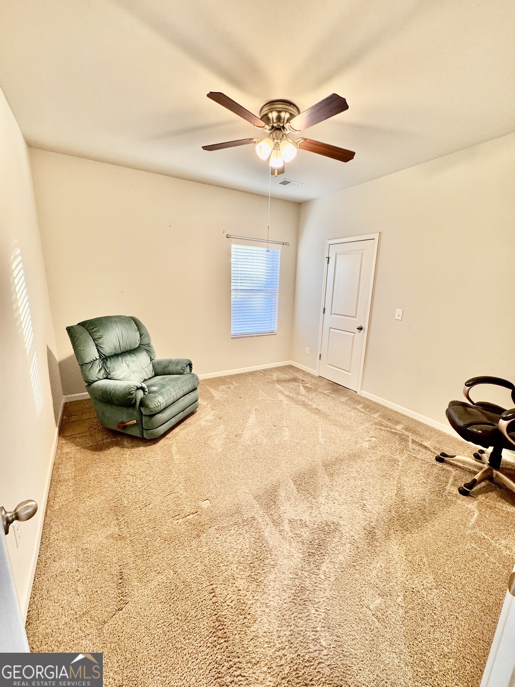 52 Pulaski Avenue Hampton, GA 30228 - Photo 11 of 32 a view of a livingroom with a chandelier furniture and windows